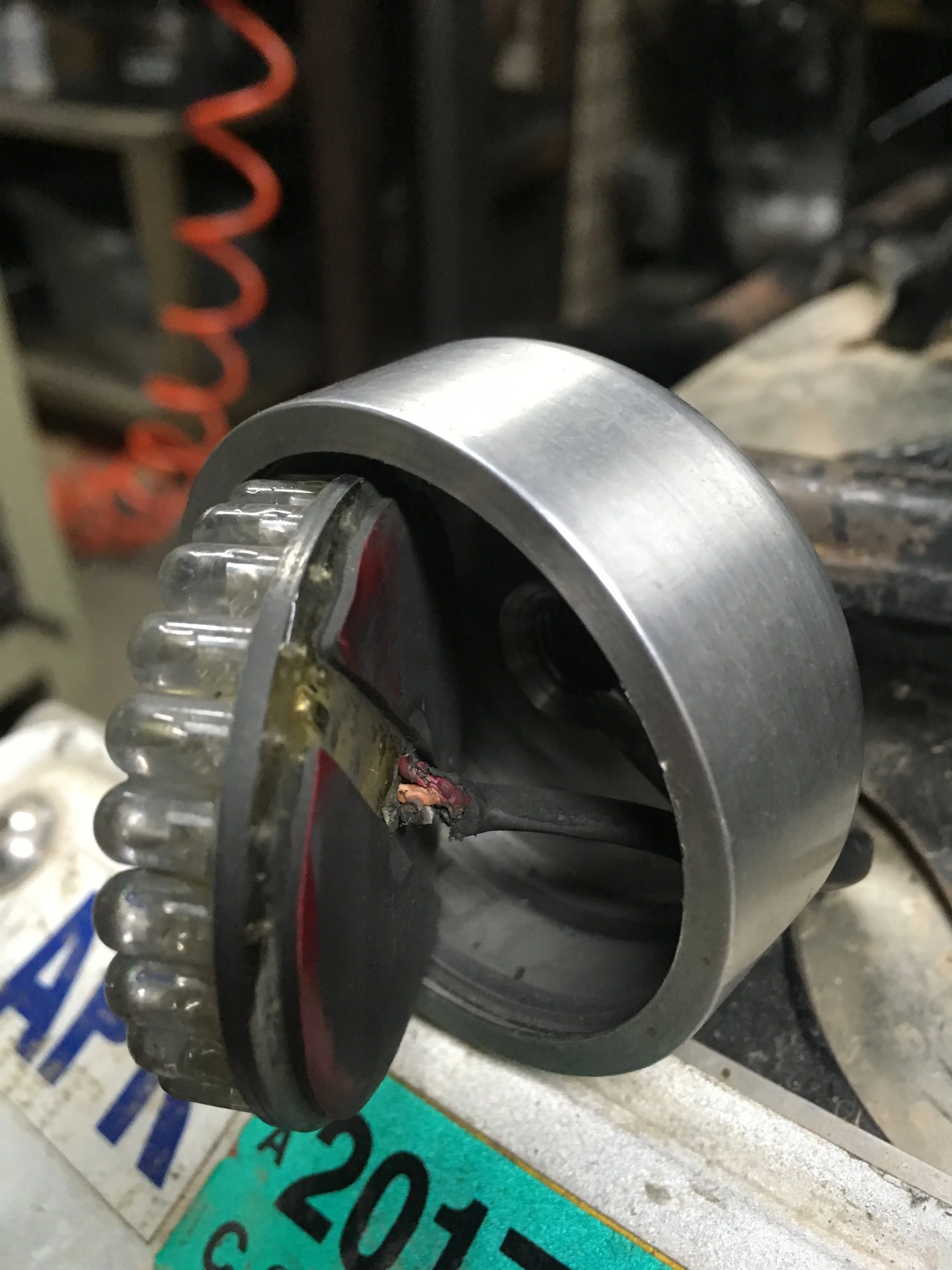 Here is the tail light wiring and the explanation for intermittent lighting. All three wires were ground either partially or completely through, and would ground against the aluminum housing enough to light occasionally. A new set of wires was graft…