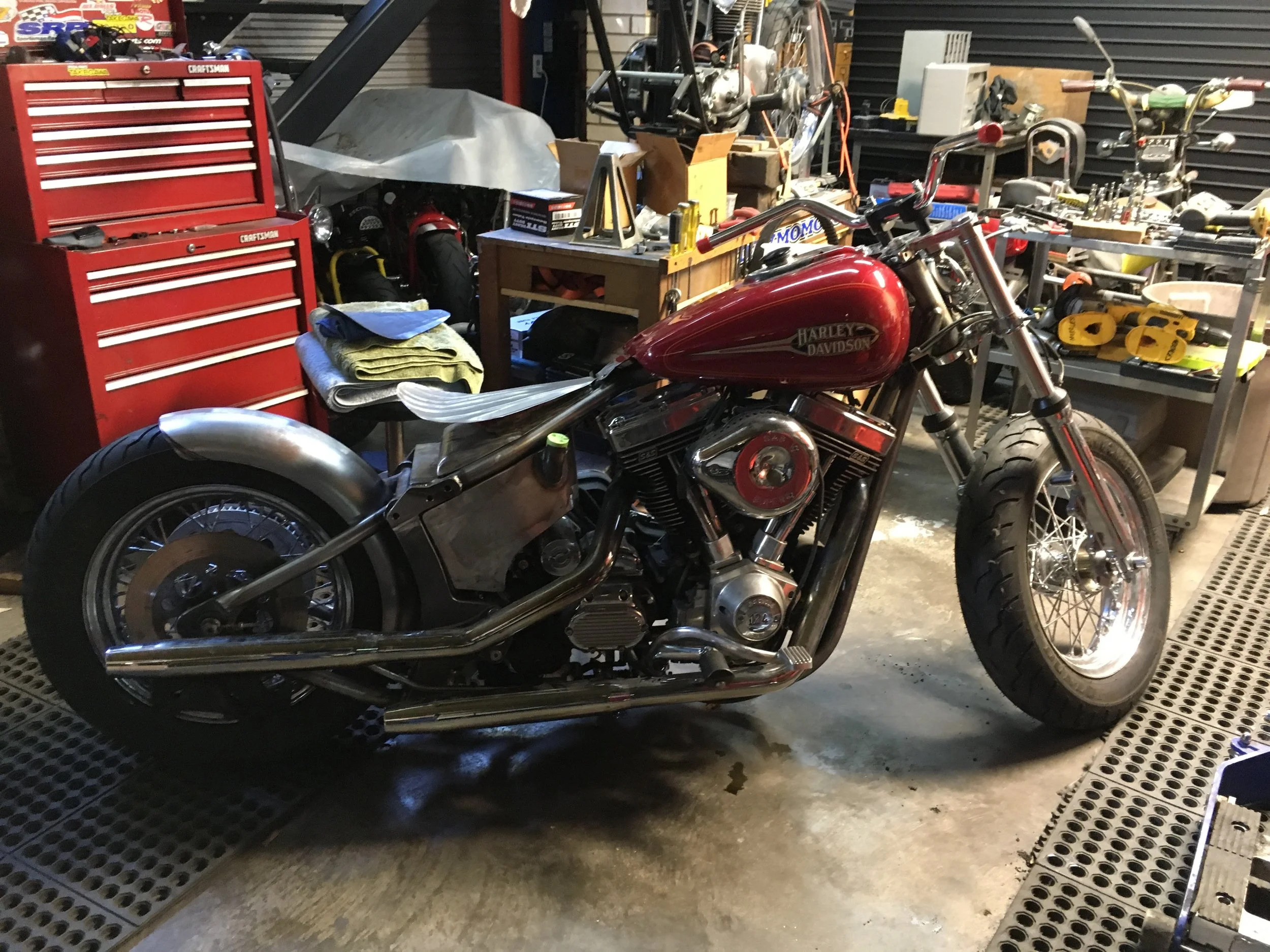 The fender is mounted and a longer seat pan is being worked out. There will be some springs under the tail of the seat to complete the look.