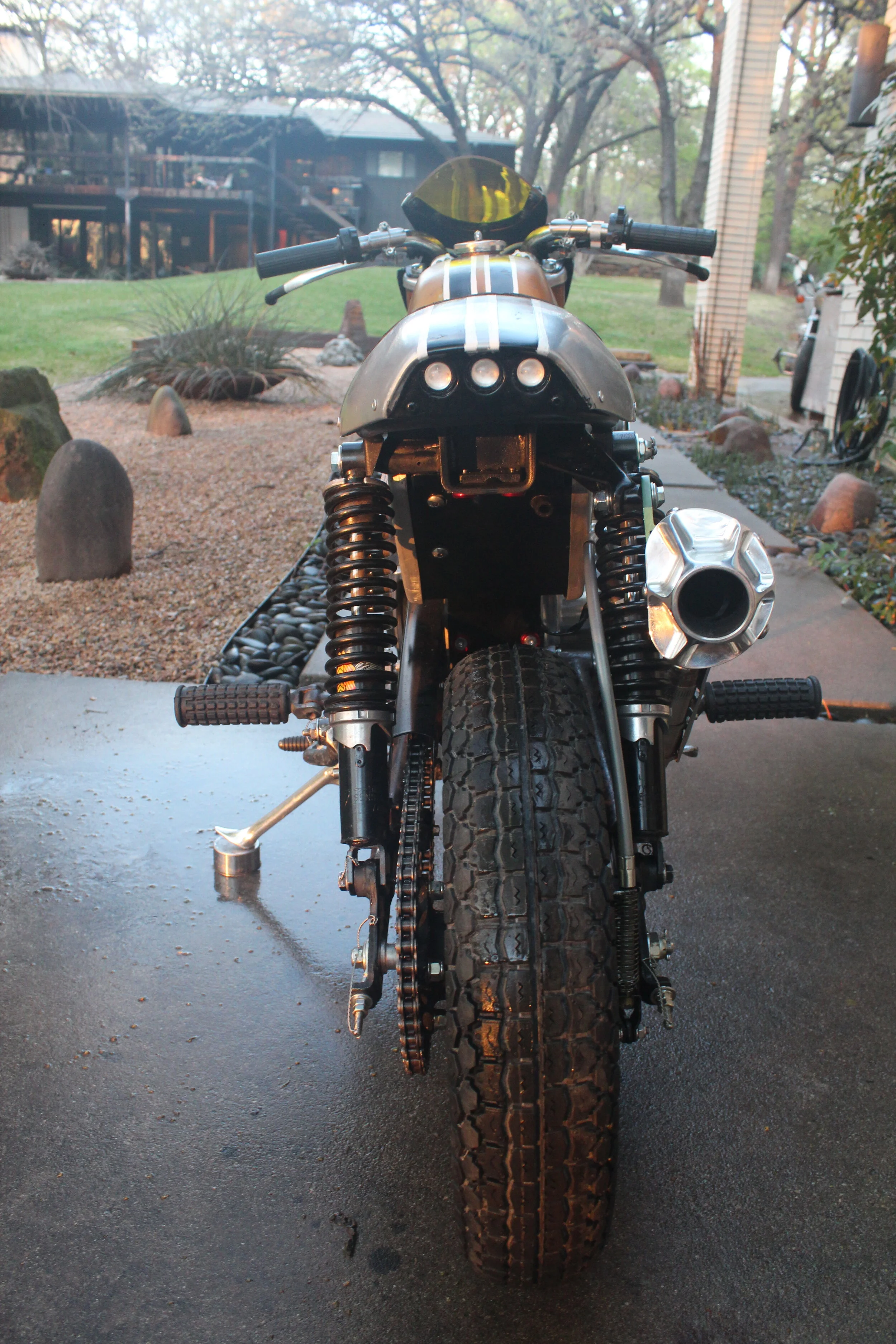  A set of Koni rear shocks and a modified Honda XR80 swingarm makes for enough room to mount the 10” Honda CRF50 wheels and a set of Heidenau K78  tires.    
