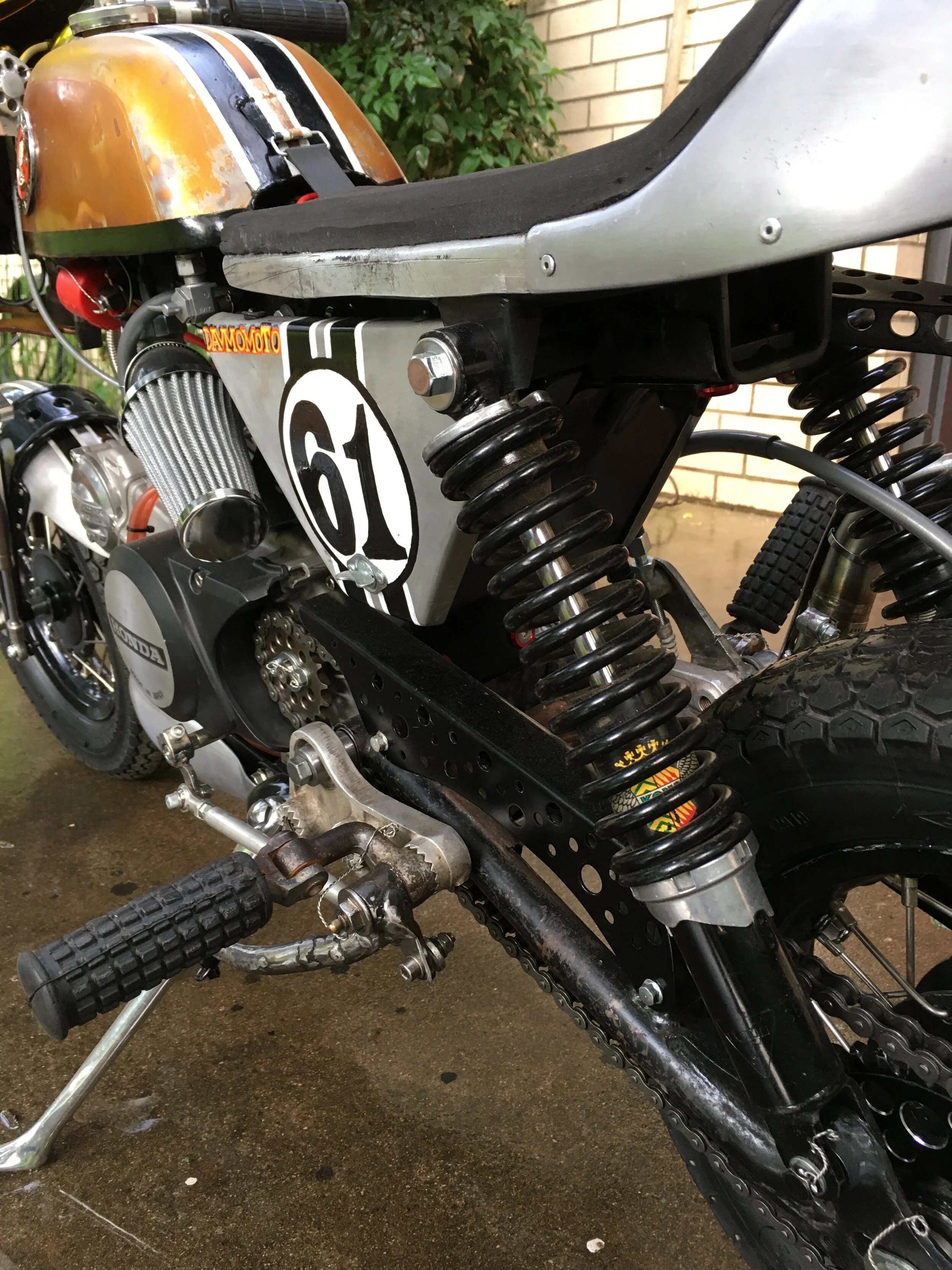  The 1960’s Honda CB77 rearset controls took some extra fabrication on the frame to mount them, but they blend in with the bike once they are. The right side brake pedal  cable means chain tightening/loosening can be done without the usual adjustment