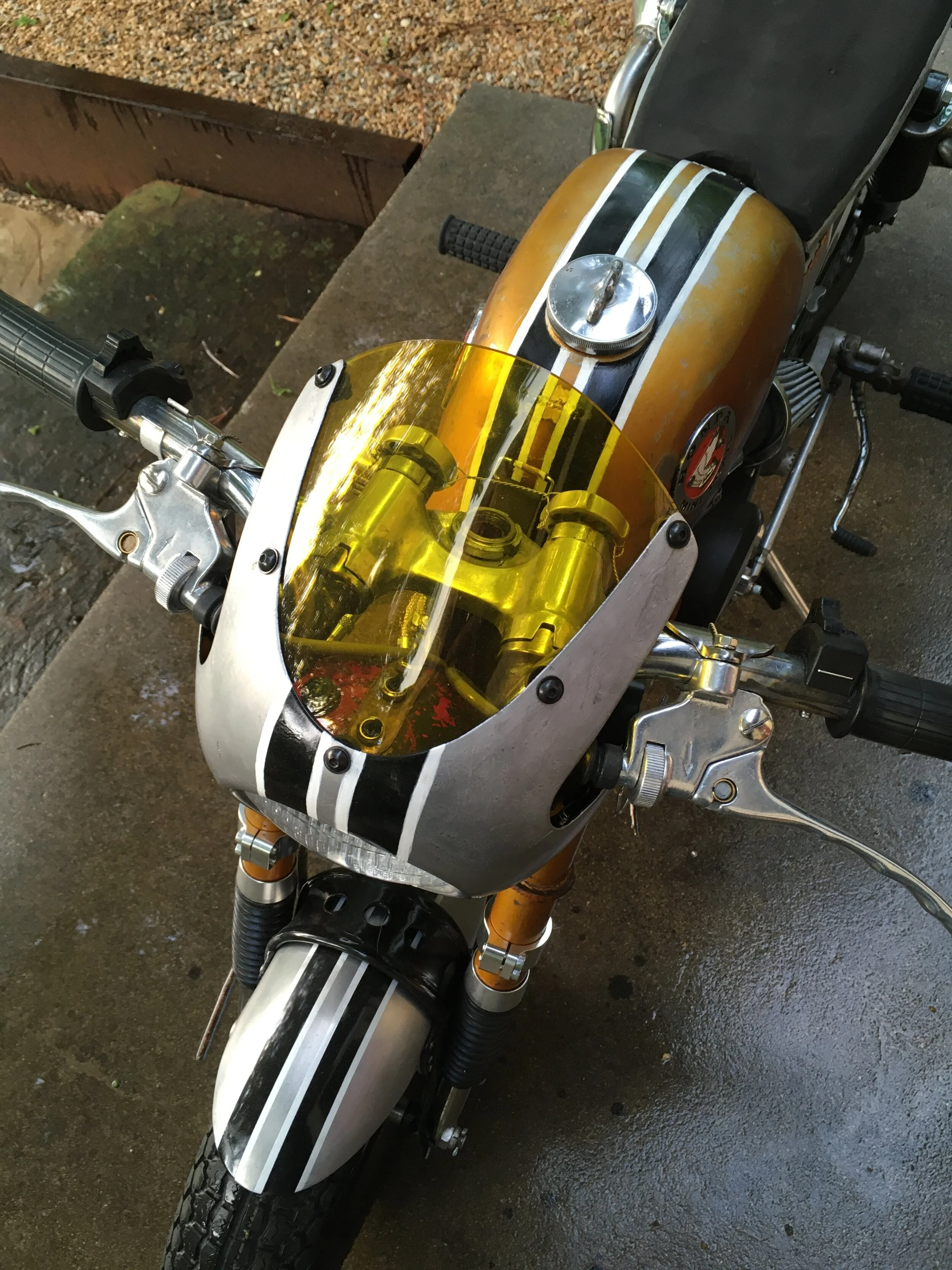  Custom aluminum body work includes the front fairing, front fender, side covers, rear inner fender, seat assembly, and belly pan, all formed from .090 aluminum sheet, and the chain guard and oil cooler cover made from .050 sheet. The handle bars are