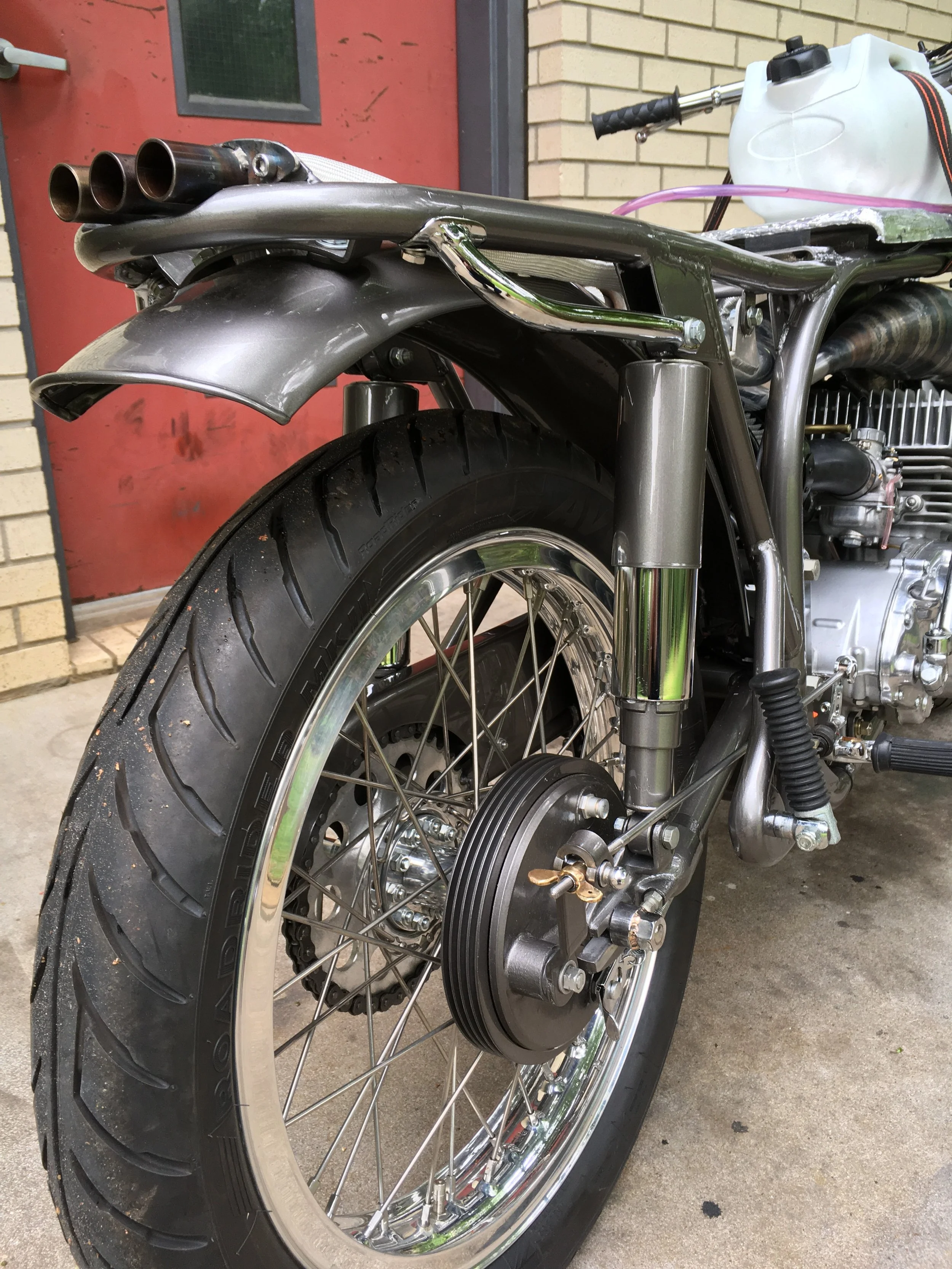  Another look at the rear frame loop and rear shock lowered mounts. This pic was during the first test ride, with tank and seat removed. 