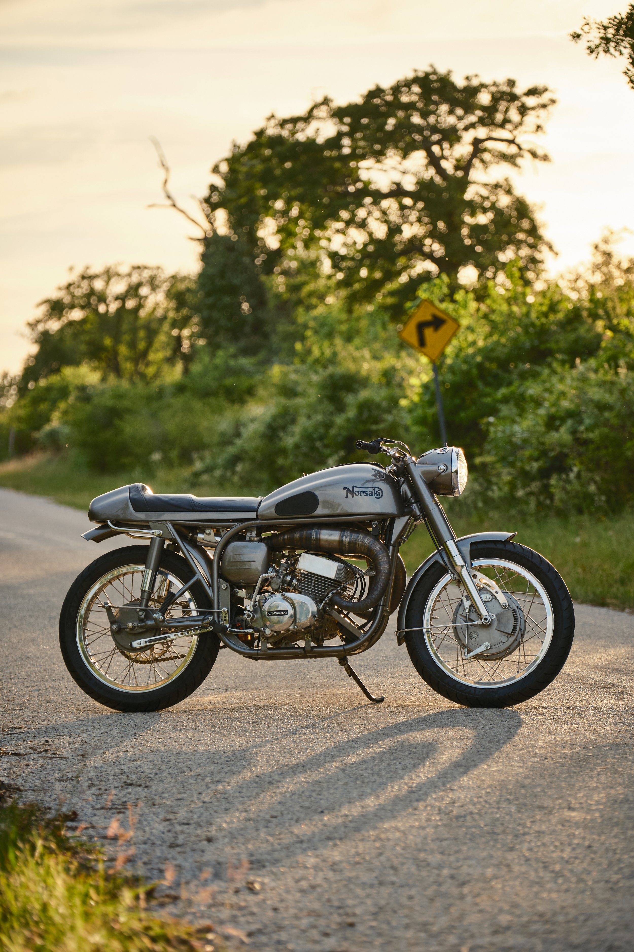  Raising the tank was necessary not just for heat issues, but also to align with the seat and get a pleasing tank-seat line. The seat was raised to allow the exhaust tail pipes to be routed underneath.   Designing the seat assembly to be removable wa