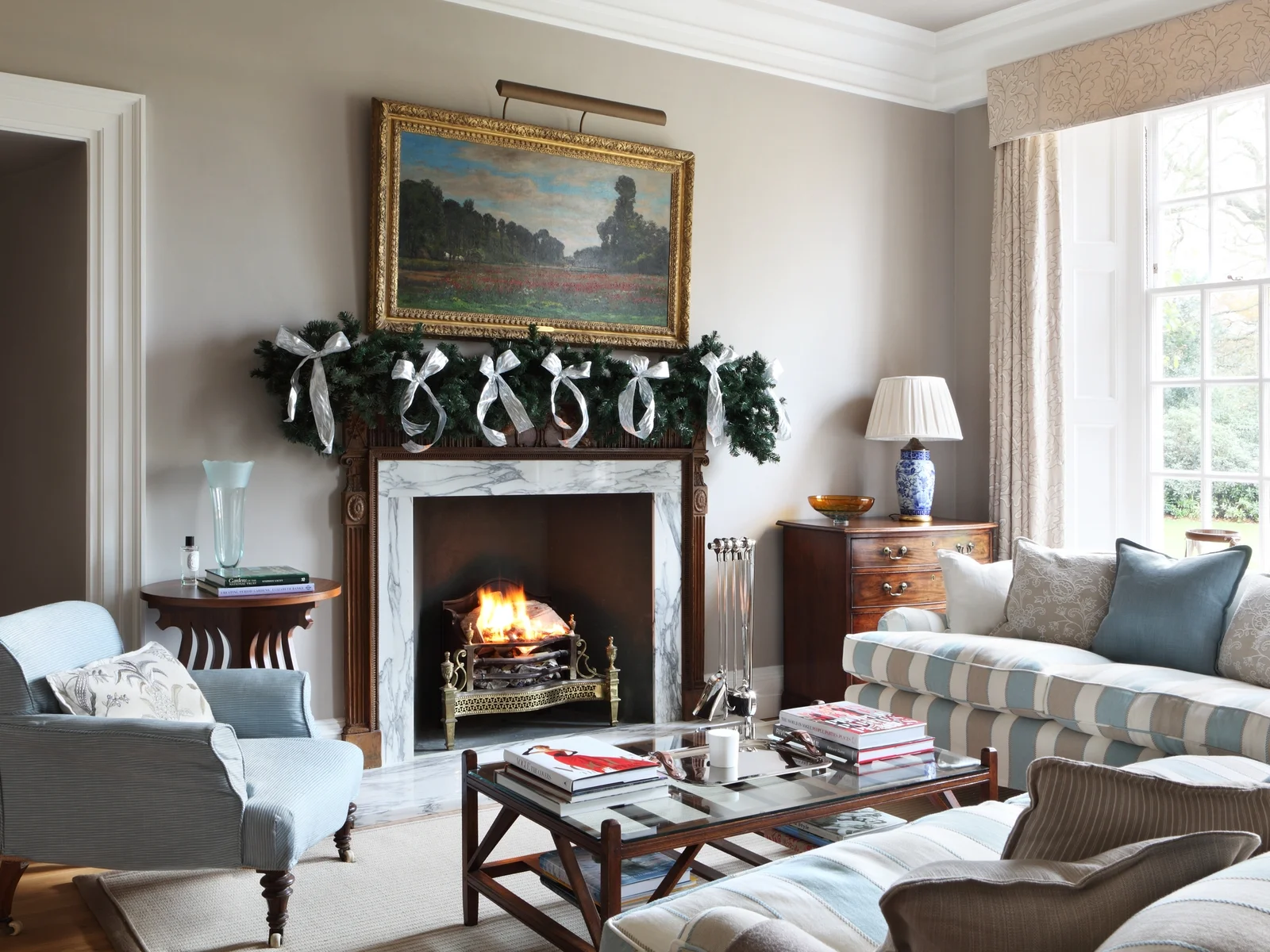 This is from our project The Manor House in Essex at christmas time. A roaring fire and decked out mantlepiece- perfection! 