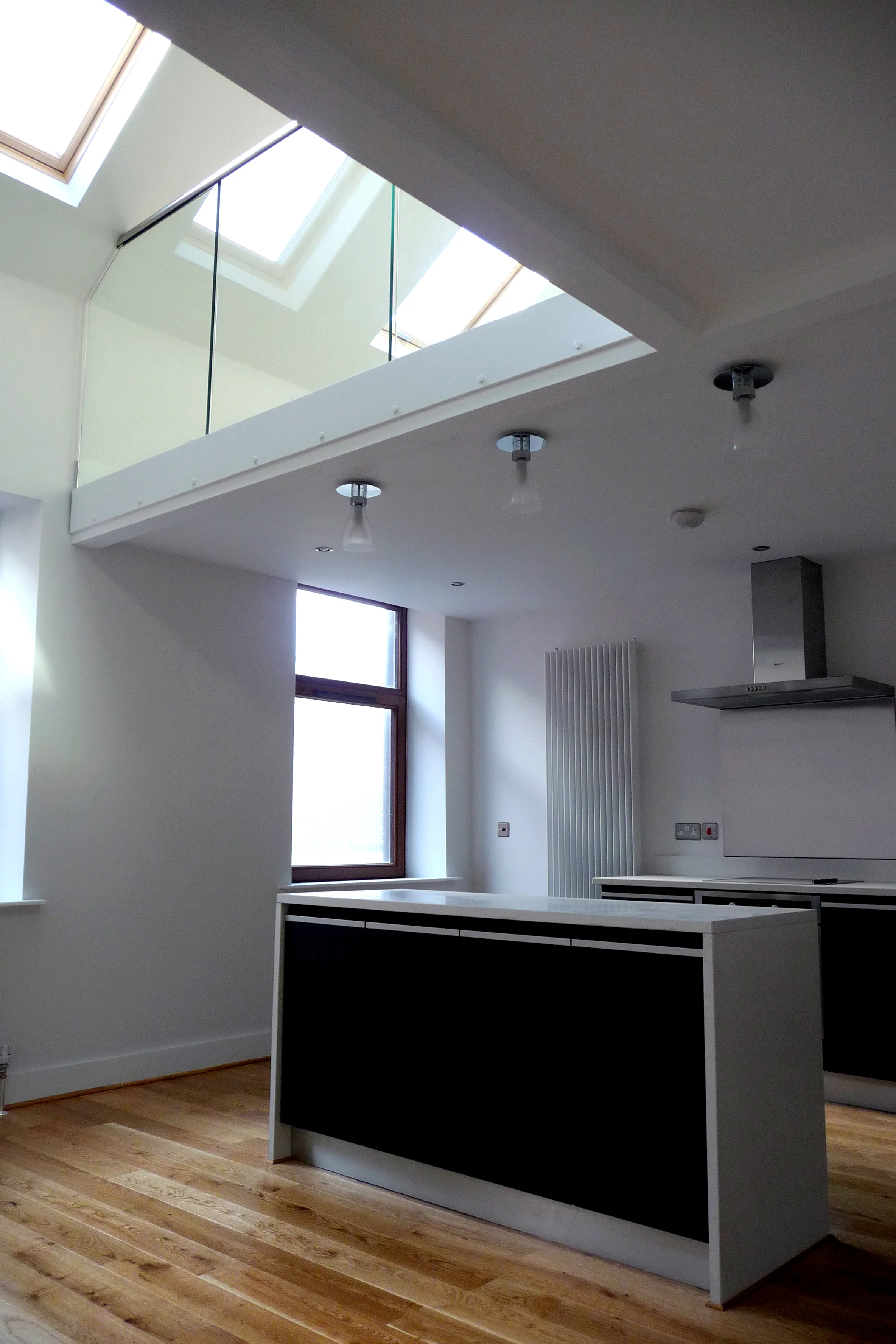 Marine Tavern Apartments The accommodation was previously used as storage for the public bar below. The client wanted a conversion that maximised the space and took full advantage of the high ceiling. We immediately recognised the potential for a mezzanine floor which would provide additional floor space. We also introduced three new roof lights to flood the apartment with south facing light. We used subtle tones and colours throughout so that the space would feel light and spacious. 