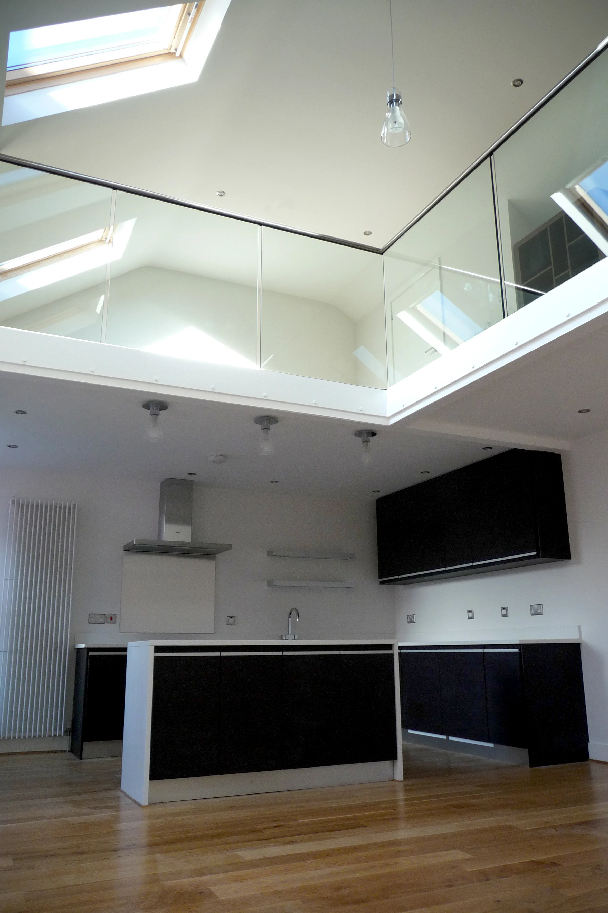 Marine Tavern Apartments The accommodation was previously used as storage for the public bar below. The client wanted a conversion that maximised the space and took full advantage of the high ceiling. We immediately recognised the potential for a mezzanine floor which would provide additional floor space. We also introduced three new roof lights to flood the apartment with south facing light. We used subtle tones and colours throughout so that the space would feel light and spacious. 