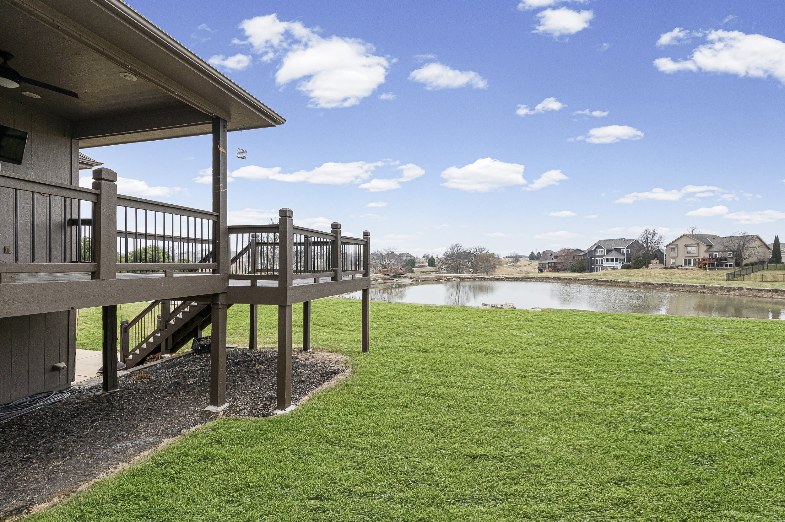 lovely kansas city back yard with pond