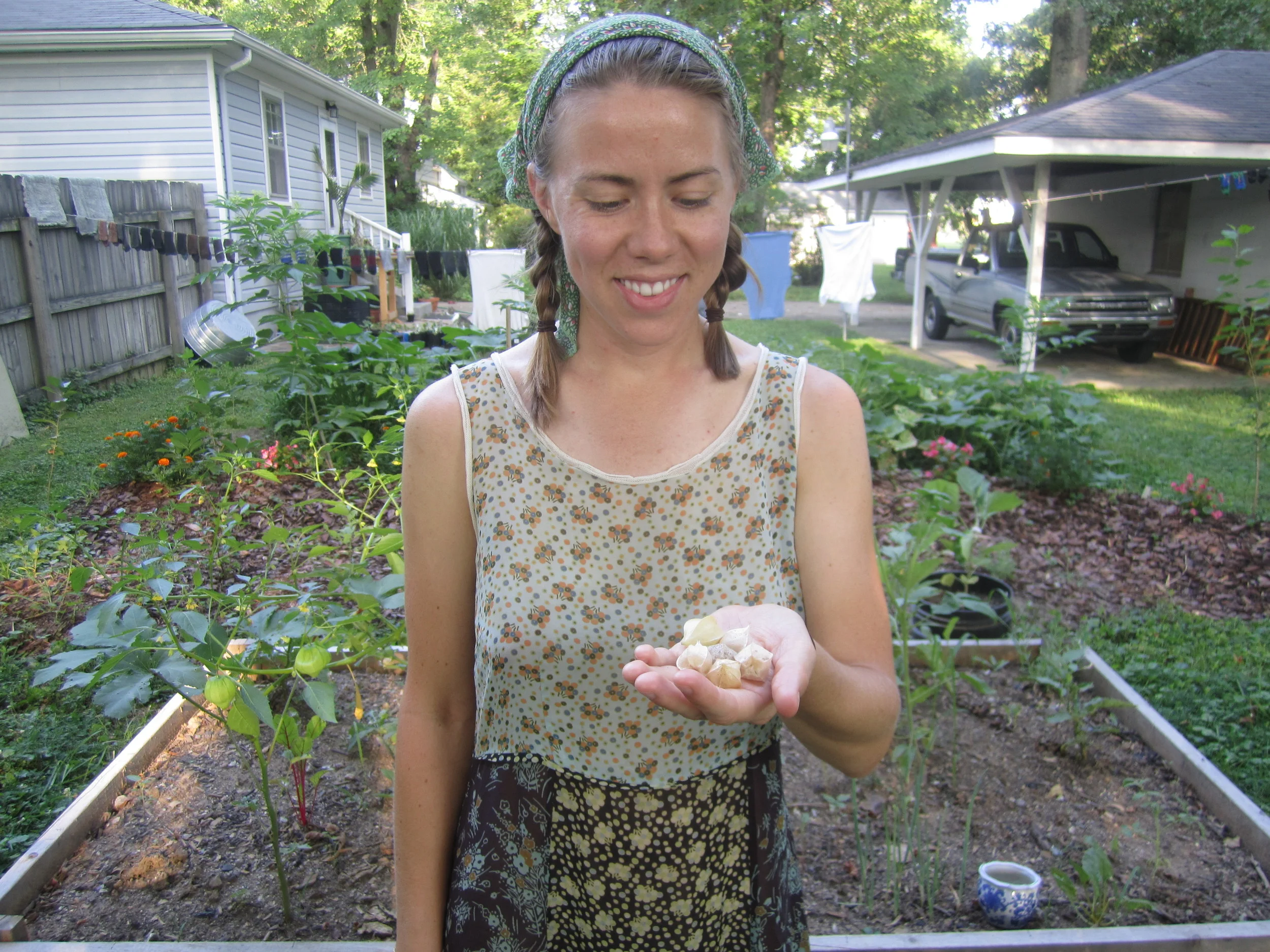 Brooke poses with a modest harvest from our backyard garden.