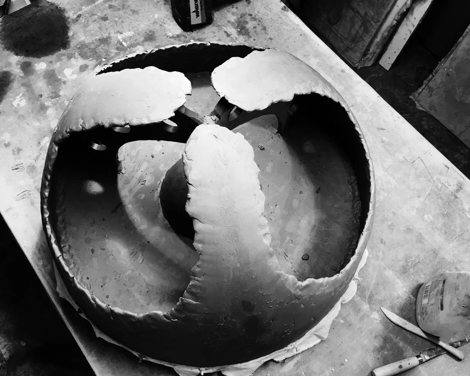 Pinch construction of side walls. On this piece I am using internal braces as guides and working out from them.