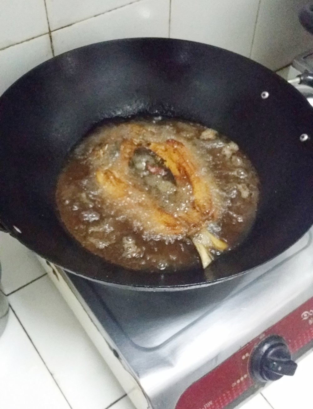 Frying the yummy Bangus (Milkfish)