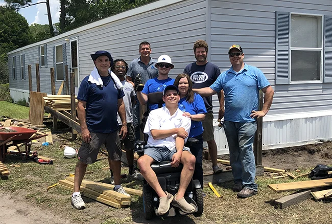 Summit & Nonprofits partner to build wheelchair ramp for family