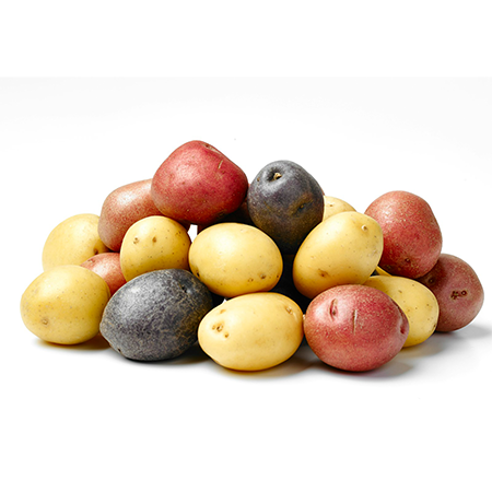 A medley of yellow, red, and purple creamer potatoes on a white background.
