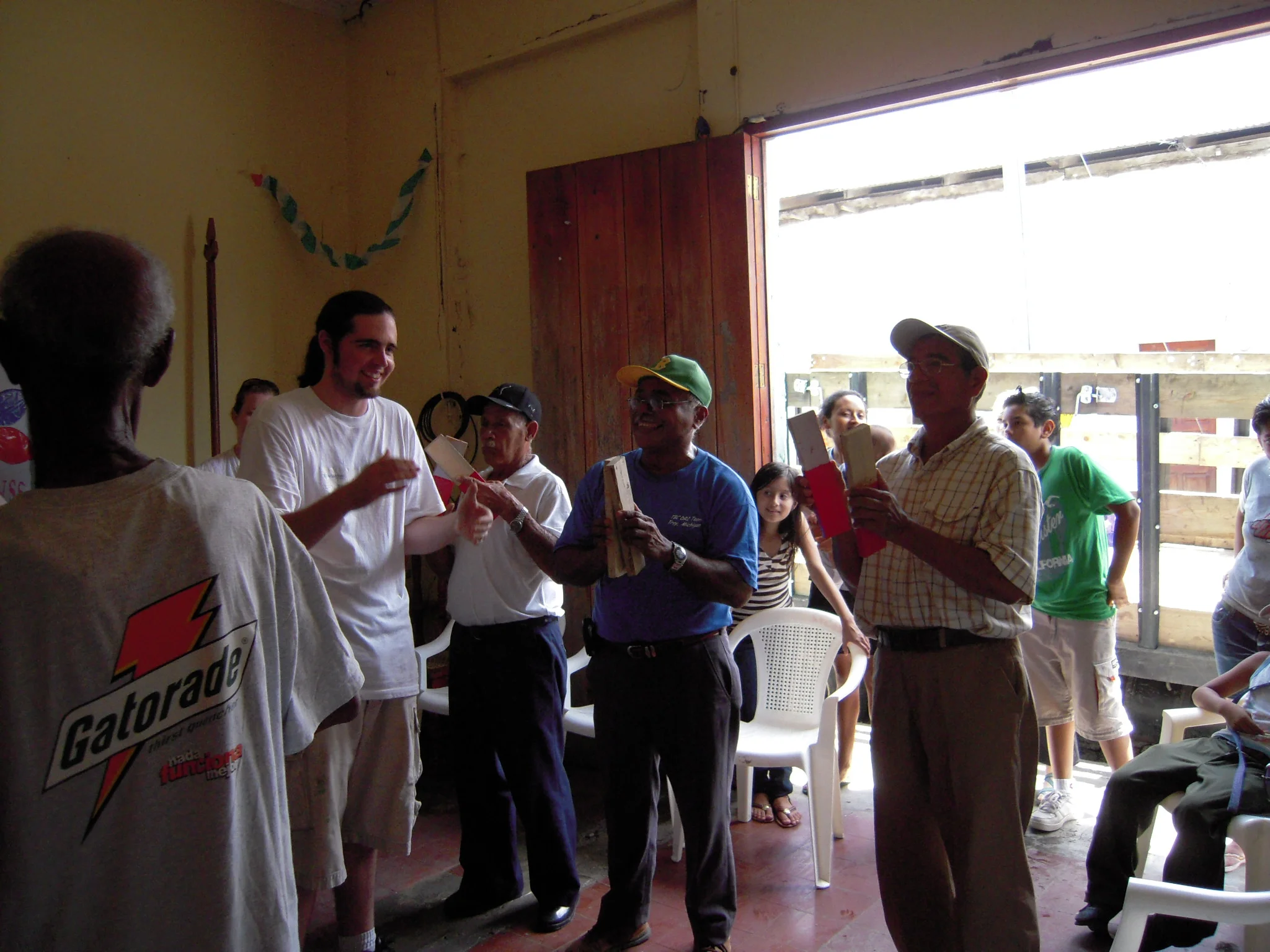 Members of the Social Security club in Managua, Nicaragua participate in a workshop on making musical instruments from household objects.