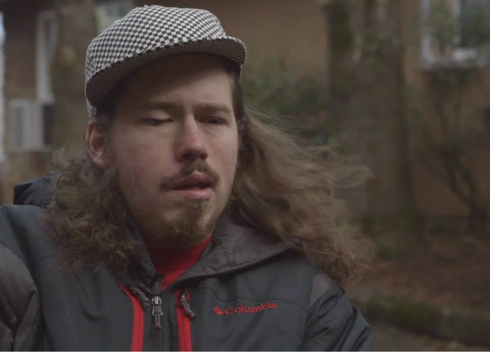 Singer-songwriter Brandon in an interview shot for Who Am I To Stop It.