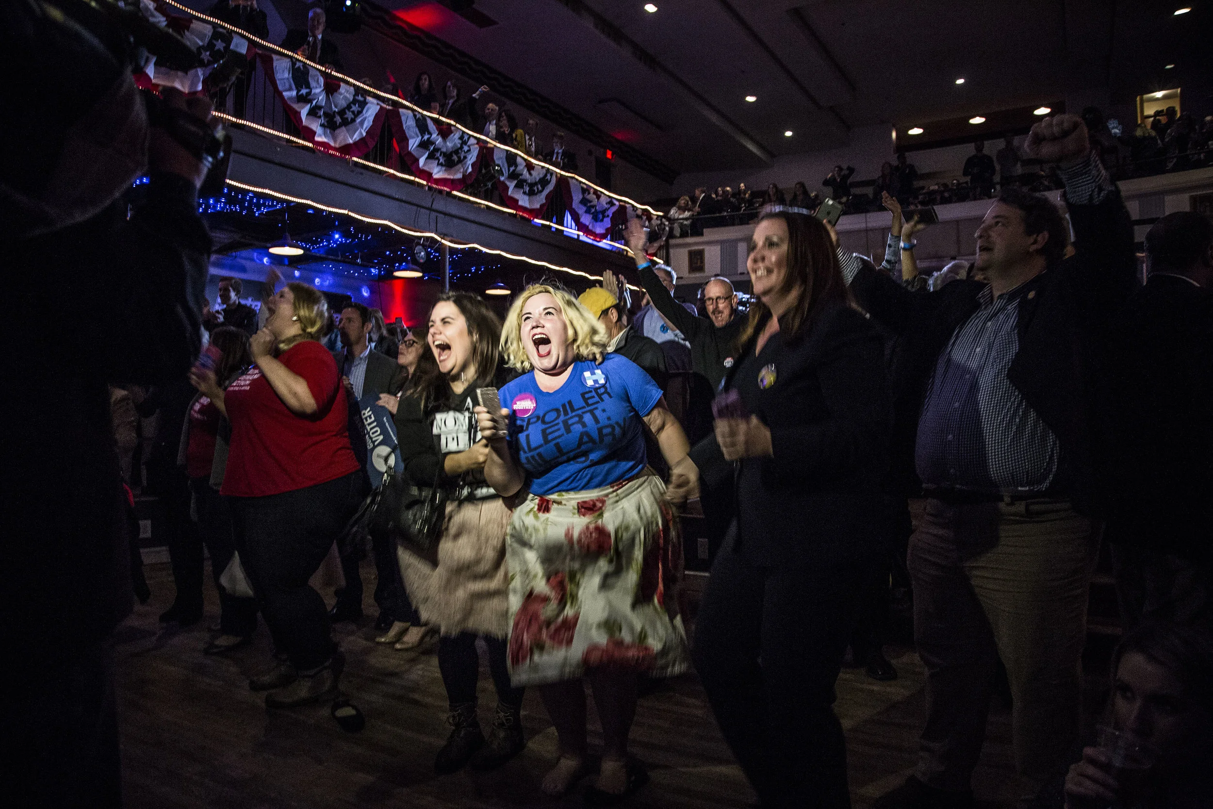 Hillary Clinton supporters react to early election results during Governor Terry McAuliffe's election night watch party in Falls Church, Va. 
