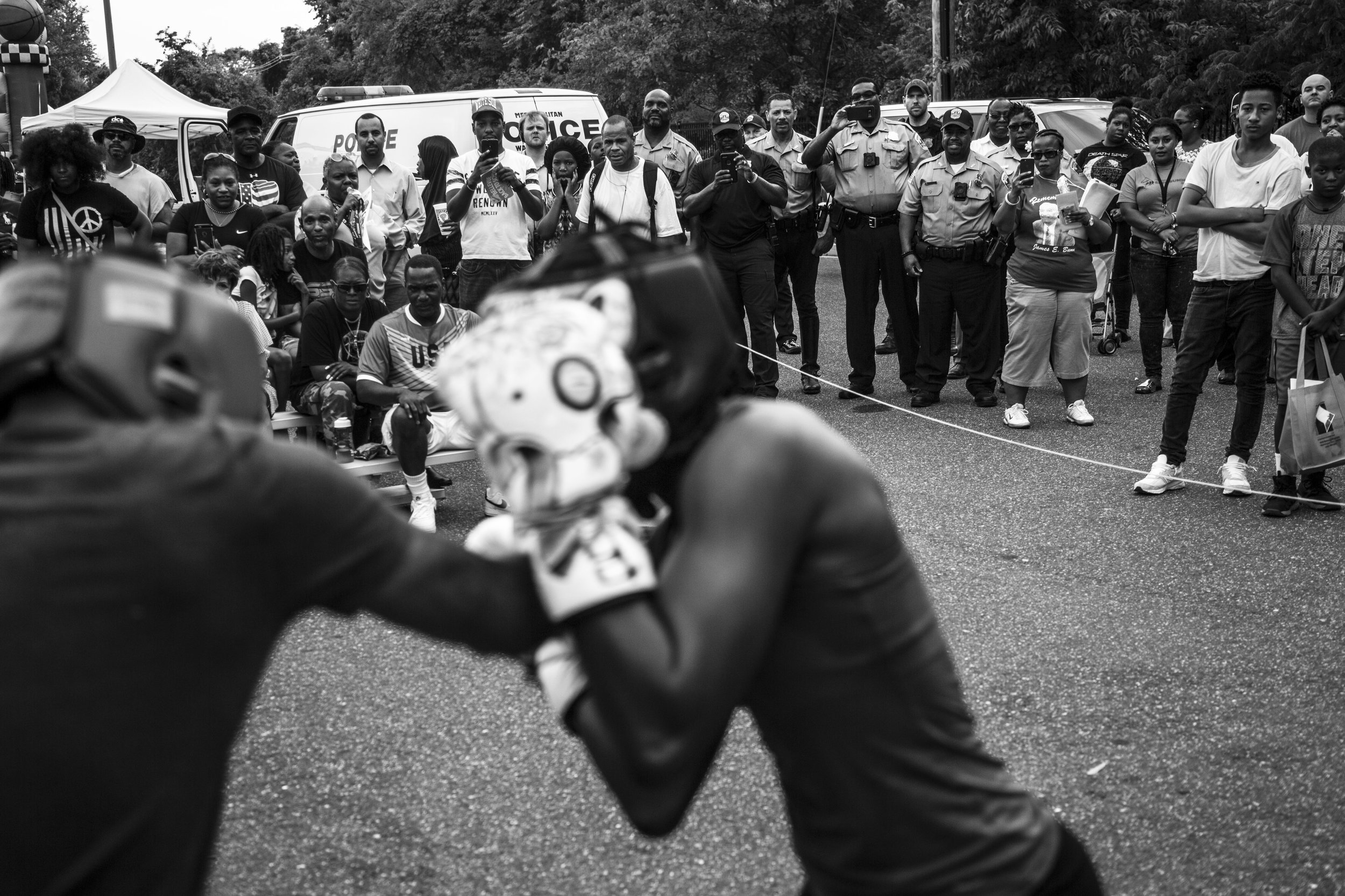   Tiara spars against a teammate in an exhibition fight during the Metropolitan Police Dept.’s National Night Out, an event that promotes police-community bonding.  