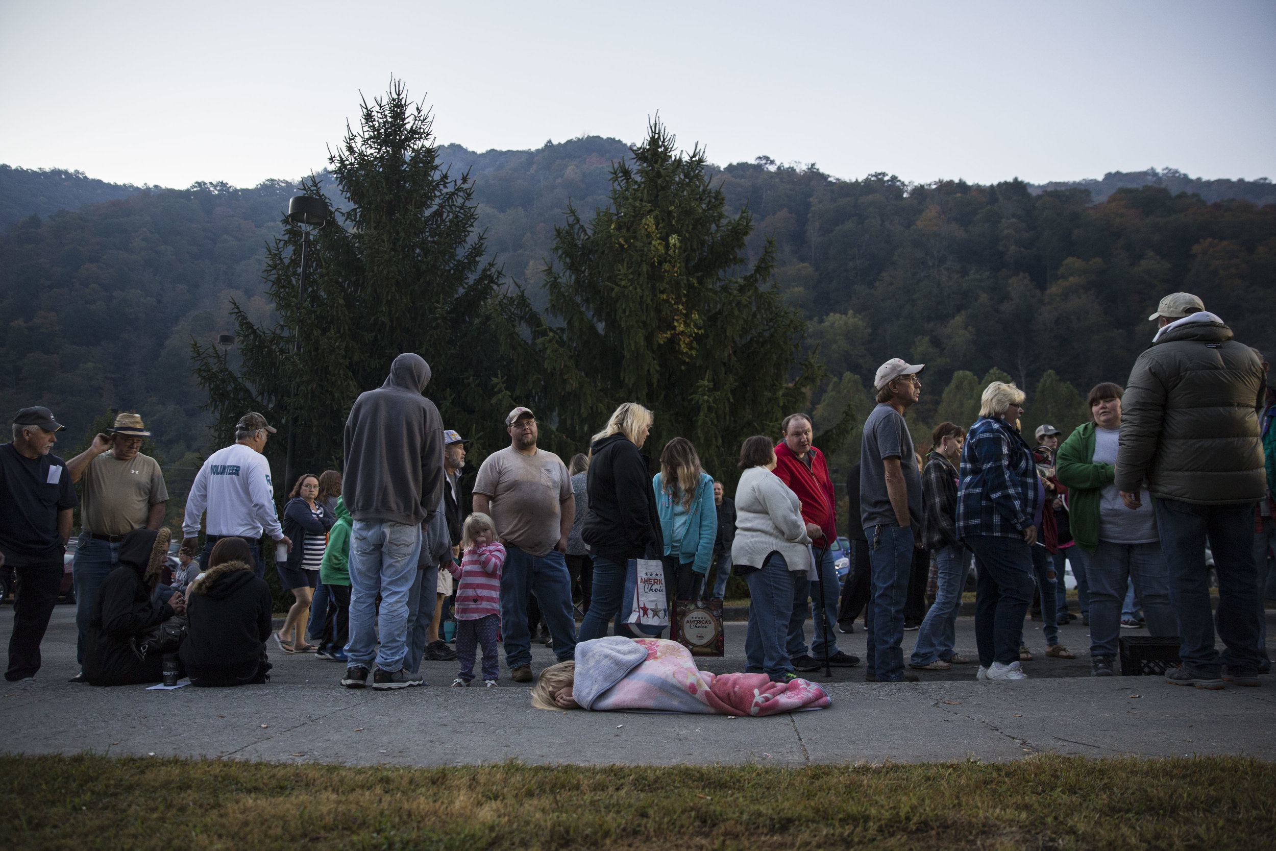   People wait to enter the Remote Area Medical (RAM) mobile clinic in Grundy, Virginia, which provided free general health services to uninsured and underinsured people in remote areas of the US.  