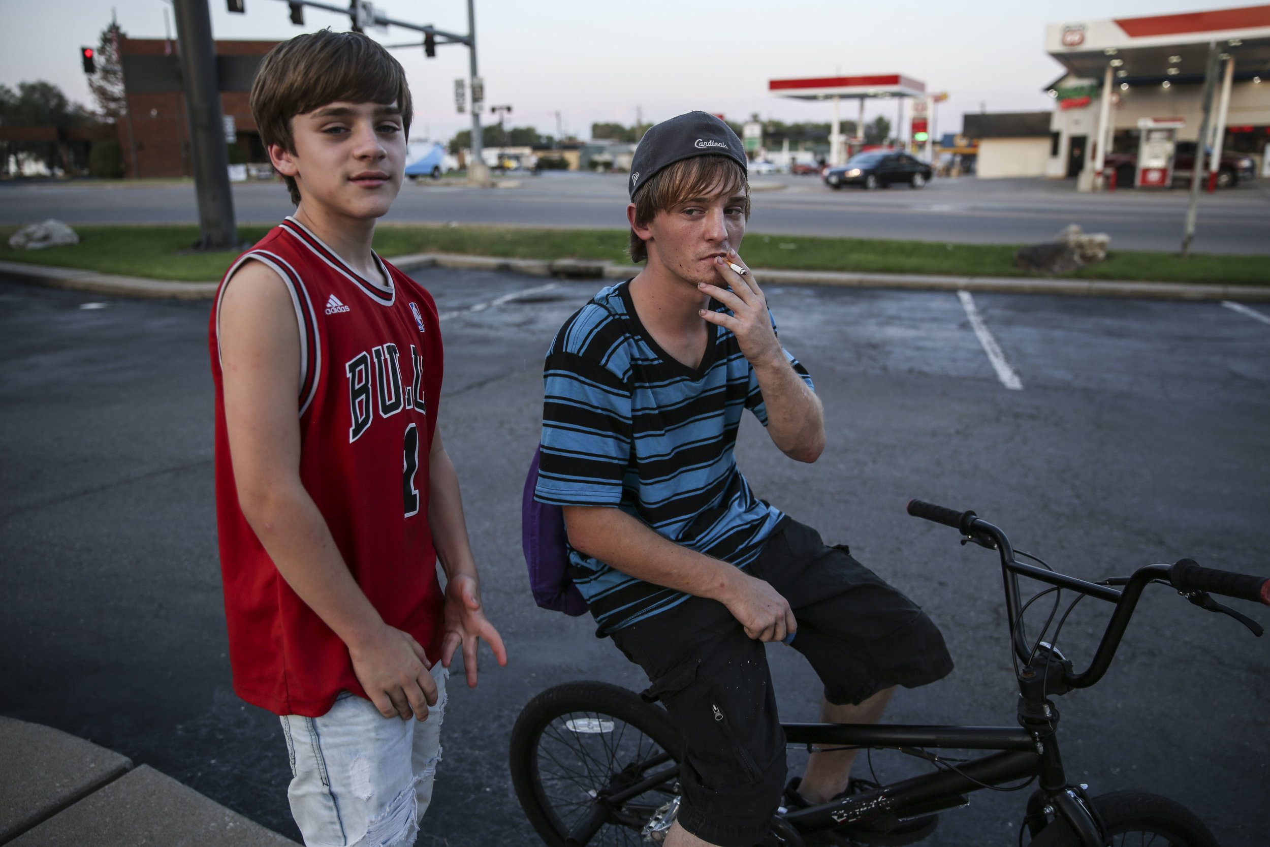   Dodge, 13, and Shawn, 20, hang out at McDonald’s, where much of the town’s youth spend time after school or late at night. Shawn currently lives in a tent in a friend’s lawn, and hopes to rent an apartment next month.  