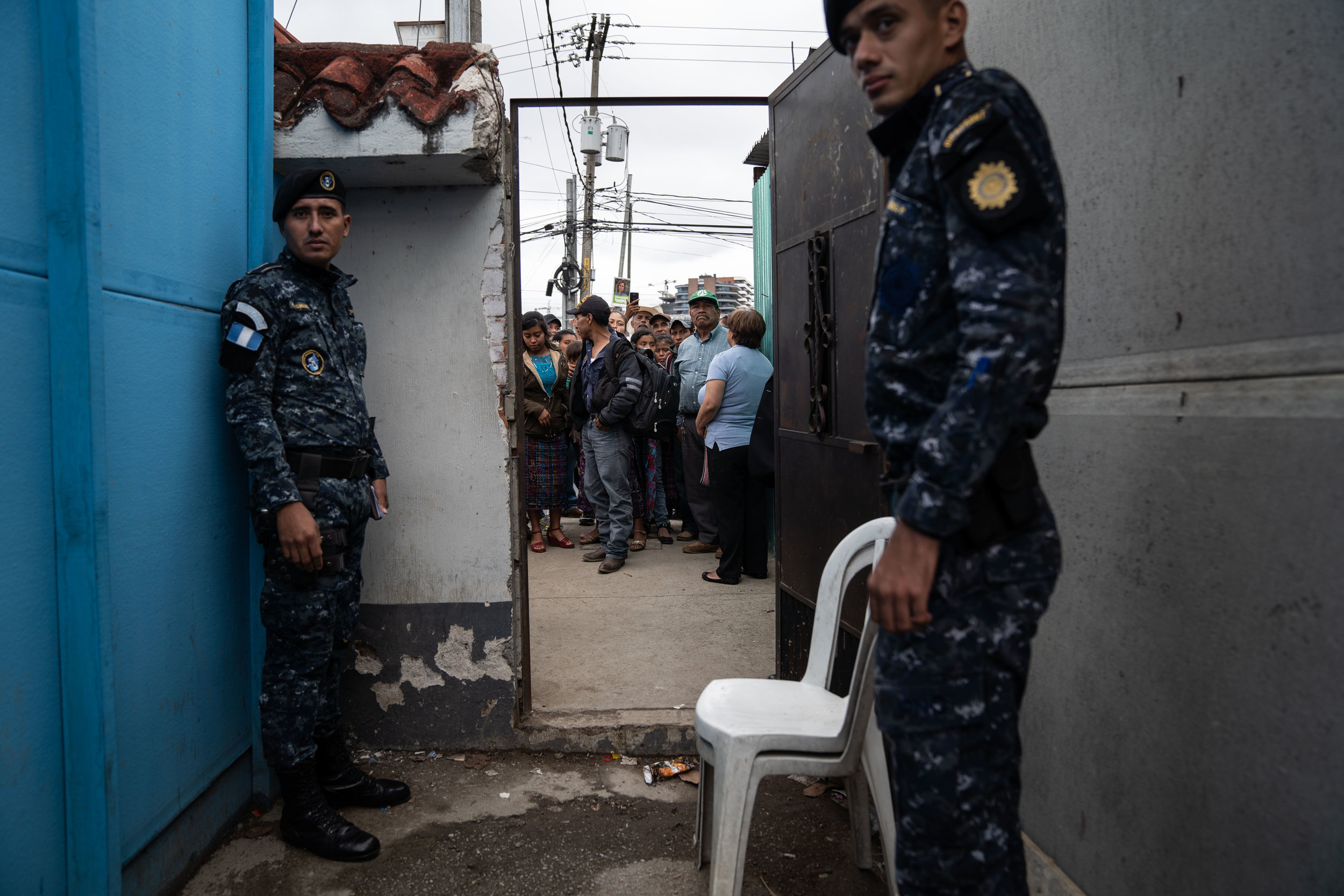   Family members and loved ones wait for Guatemalan deportees to exit a Repatriation Center in Guatemala City in May, 2019.  
