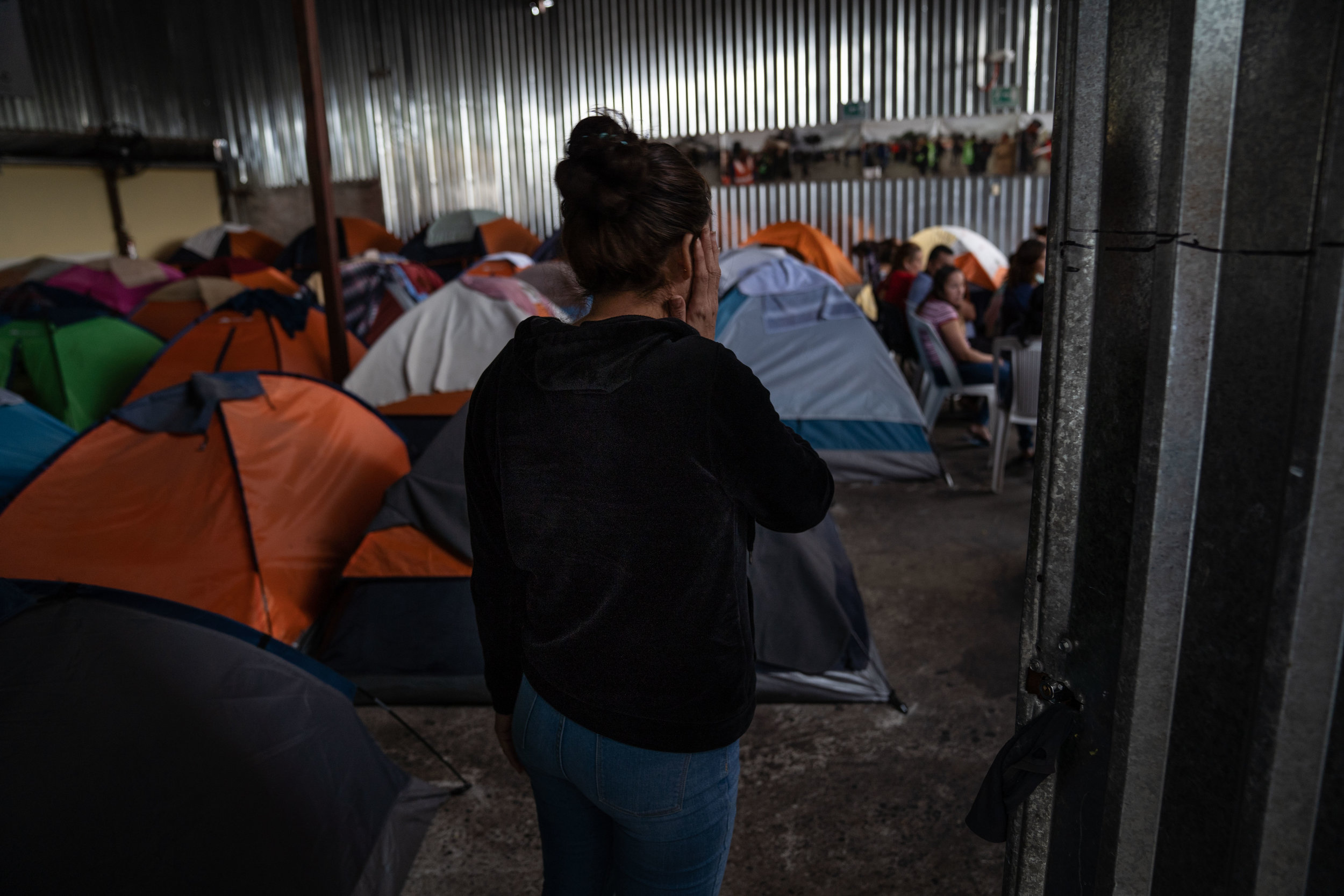   A migrant who was returned to Mexico under the “Remain in Mexico” policy walks at a shelter in Tijuana in May, 2019.  