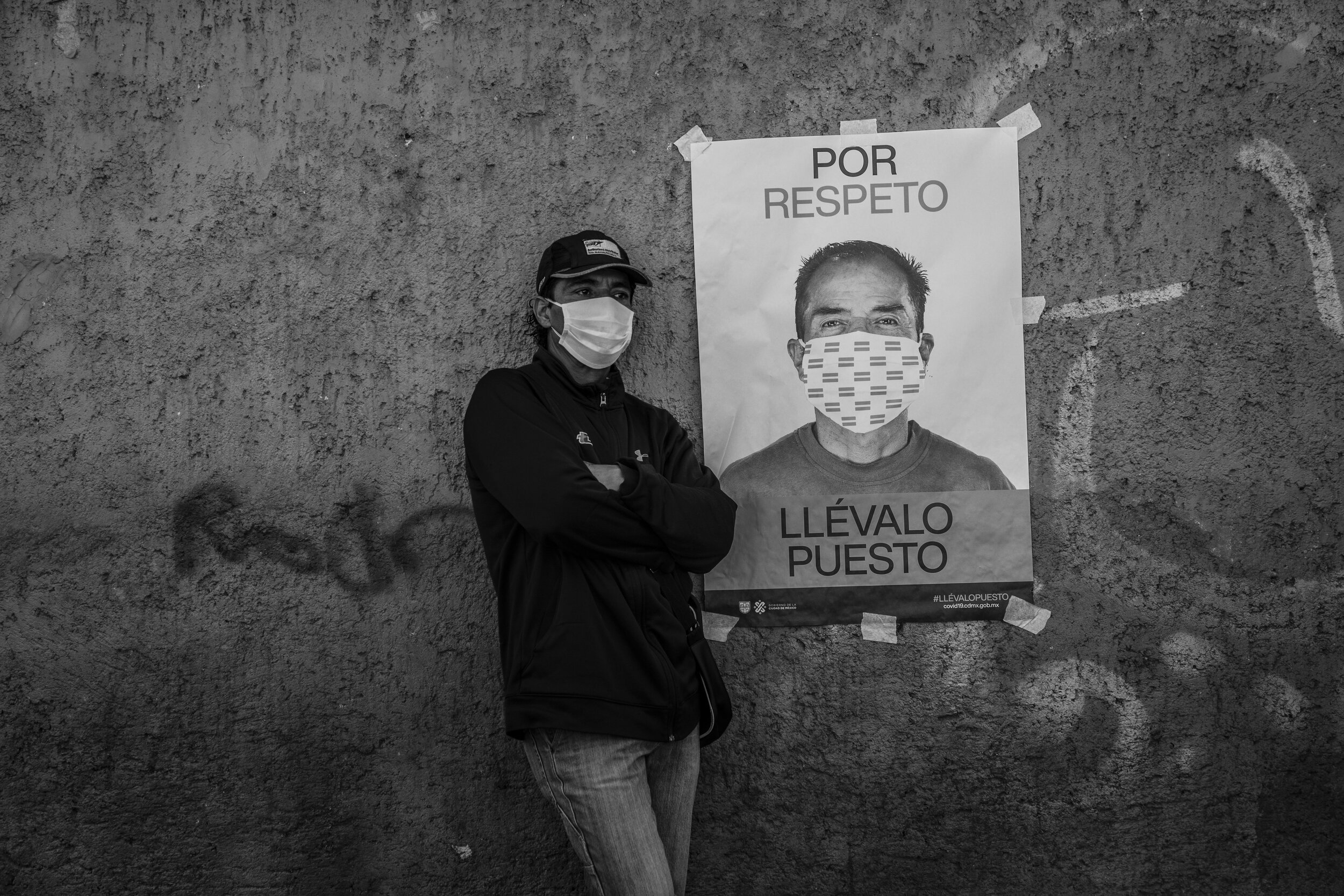   A man wearing a face mask waits in line at a makeshift mobile health station where COVID-19 tests are carried out, Mexico City.   
