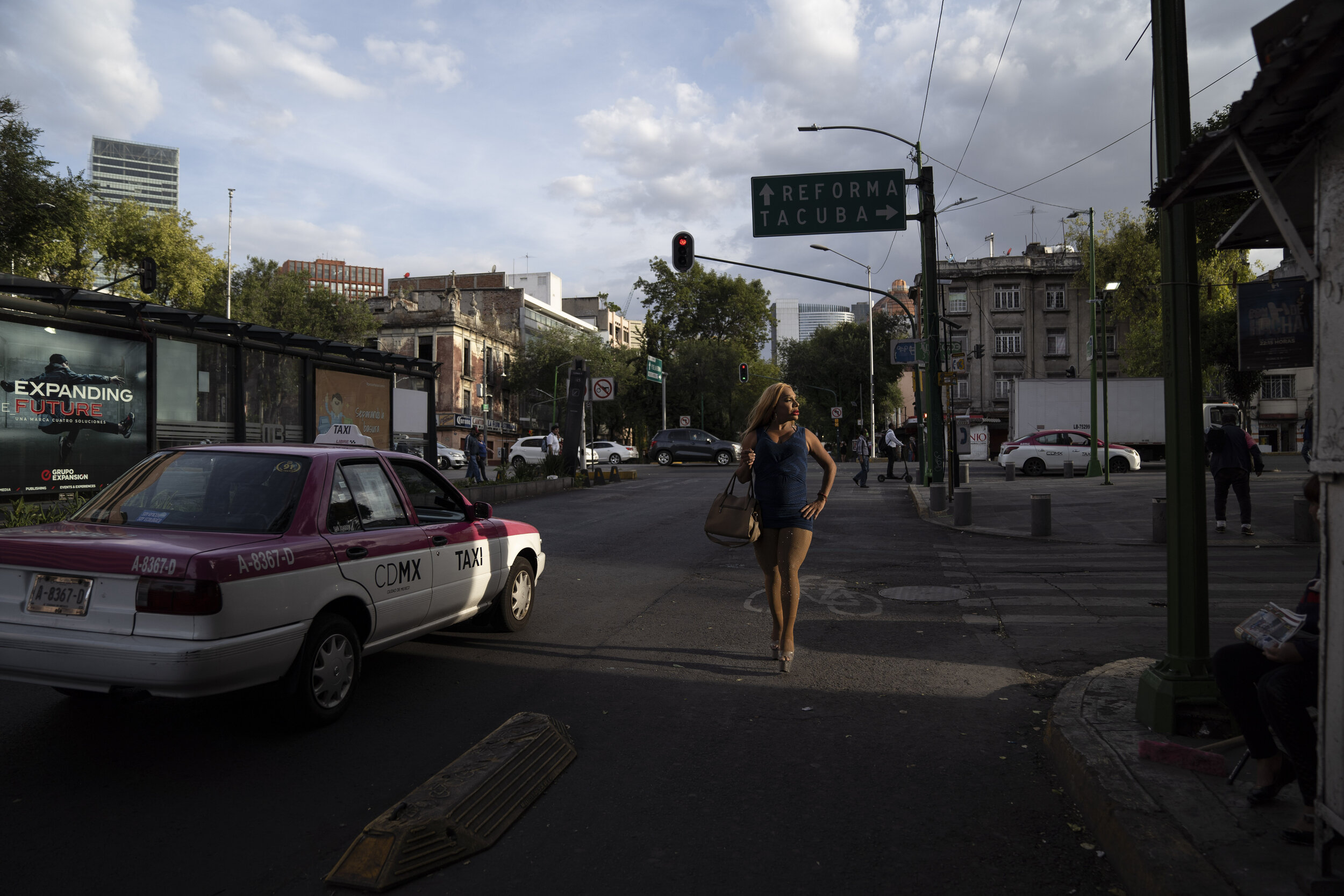   Escarlet, a trans sex worker, walks in Mexico City. Sex workers have been severely affected by the lack of clients willing to risk the contact during the pandemic.   