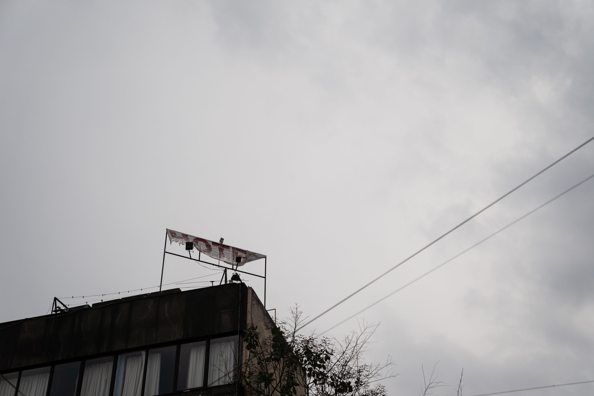   A weather-beaten hotel sign hangs in the Buenavista neighborhood.   