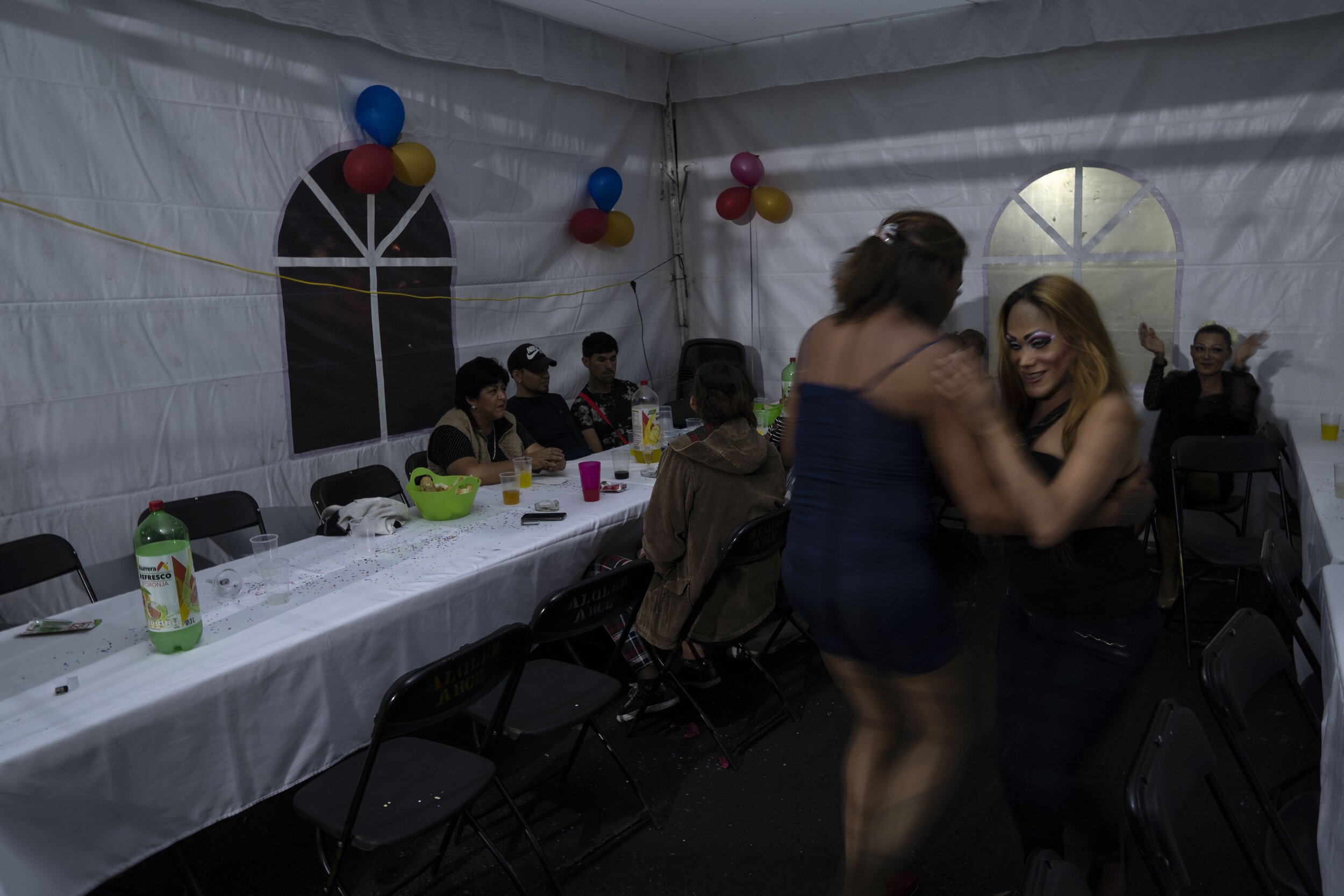   Nicky dances with her friend Kenya during a birthday party in Chalco, State of Mexico.   