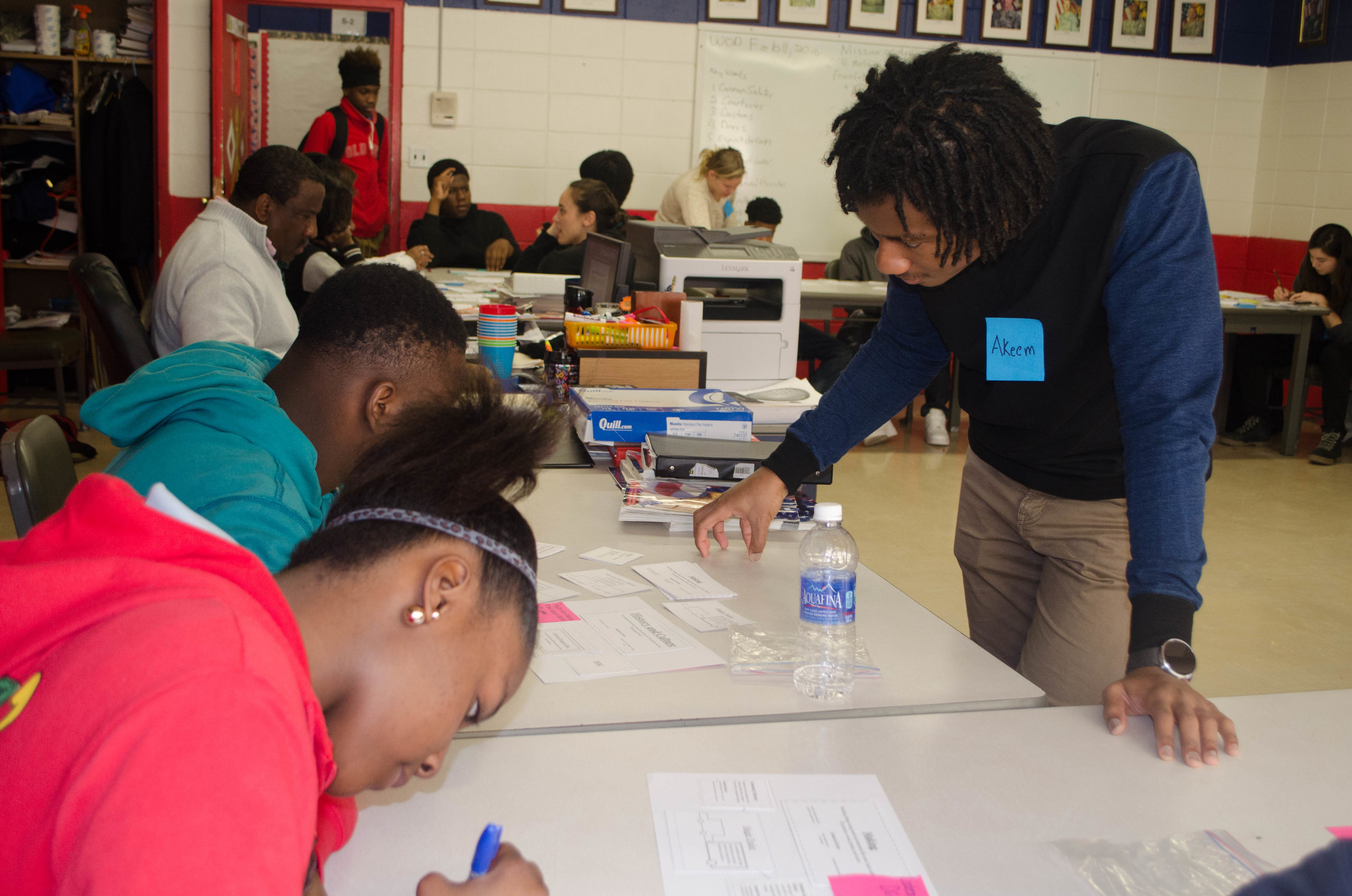 Doing a card-sorting co-design activity with Clarksdale youth at the Ombudsman high school.