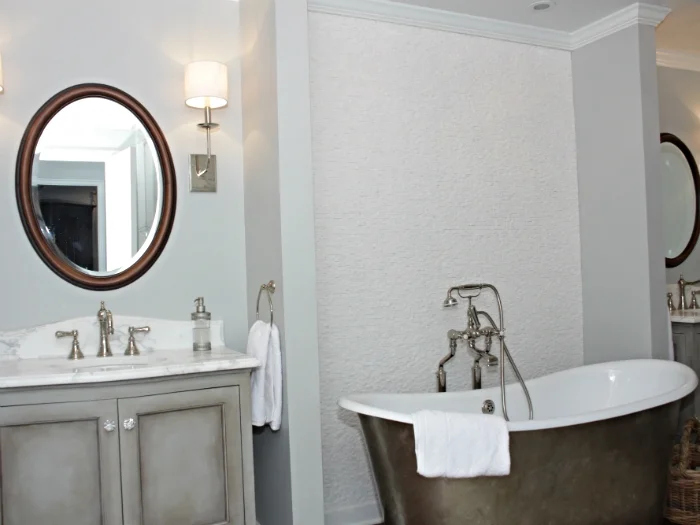 Scarsdale tudor with custom vanities and faux painted, free-standing Waterworks tub