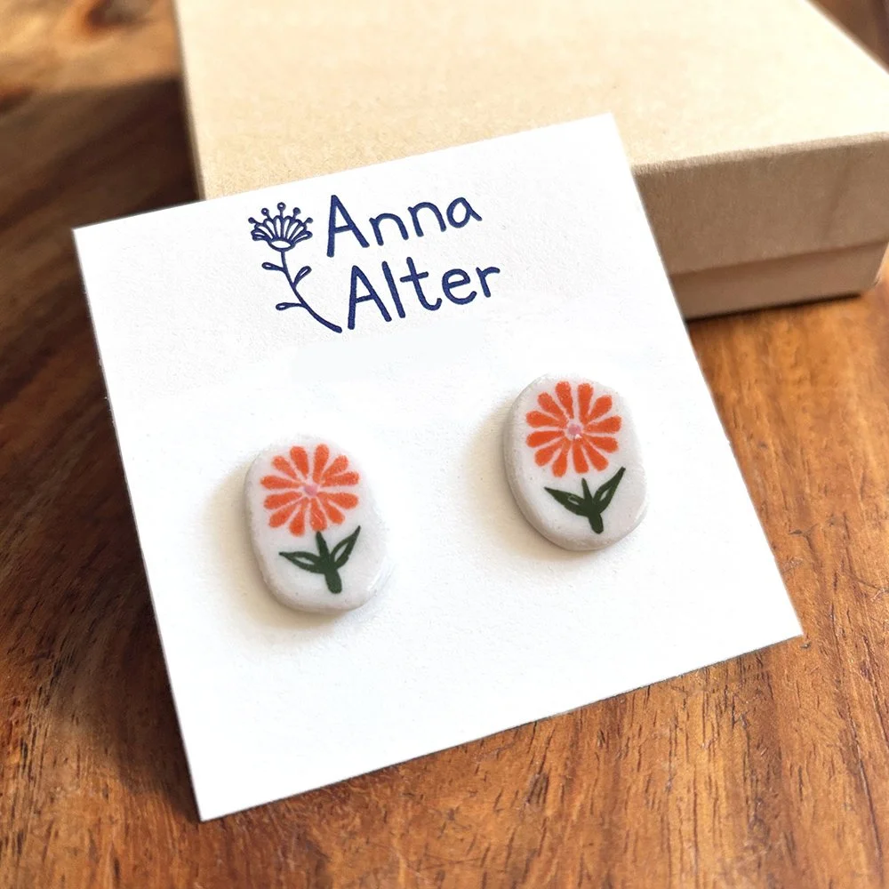orange daisy oval stud.jpg