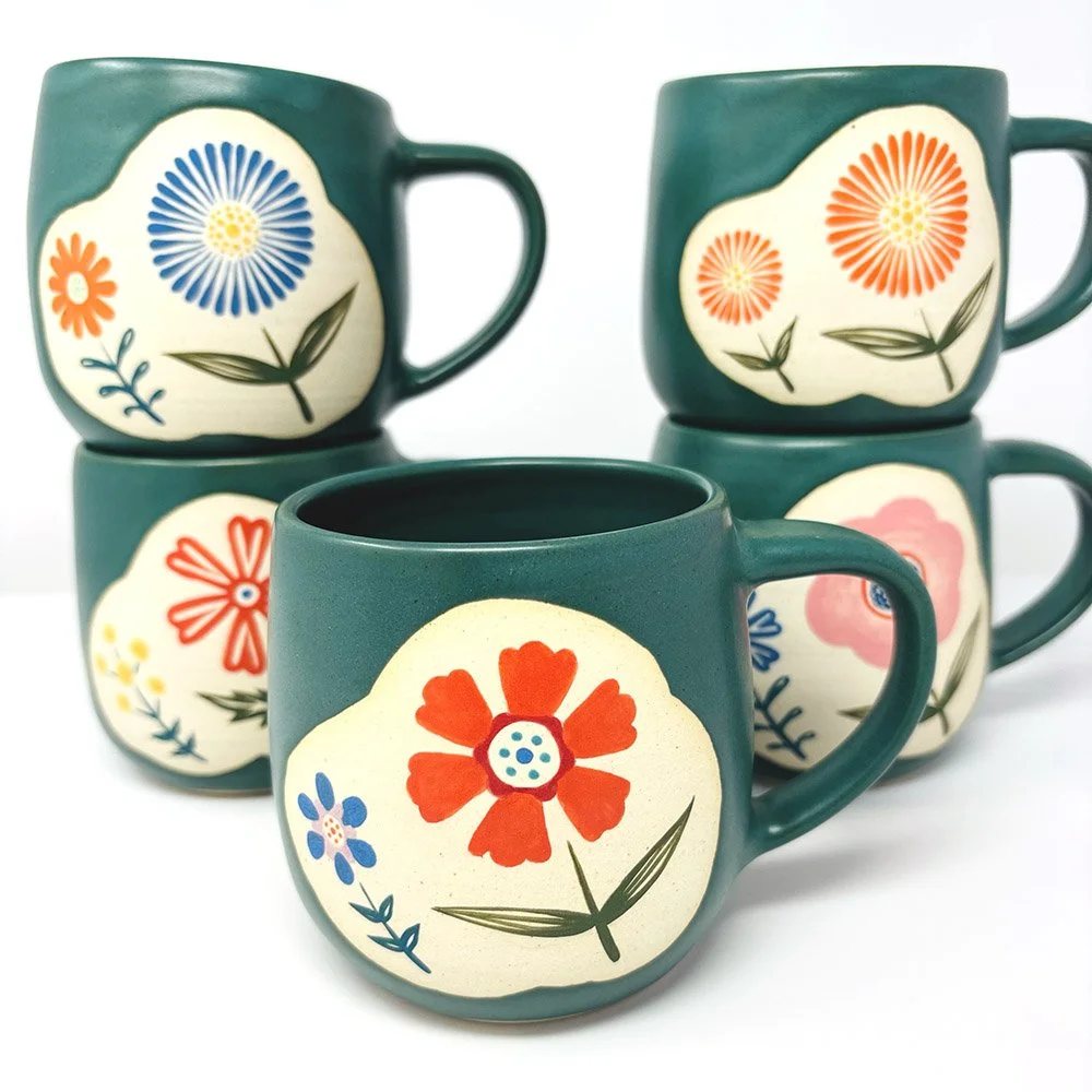 Green flower mugs in white
