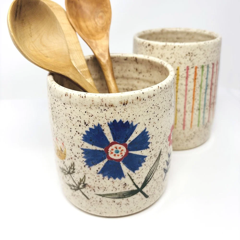 Blue flower and stripe canisters in speckled clay