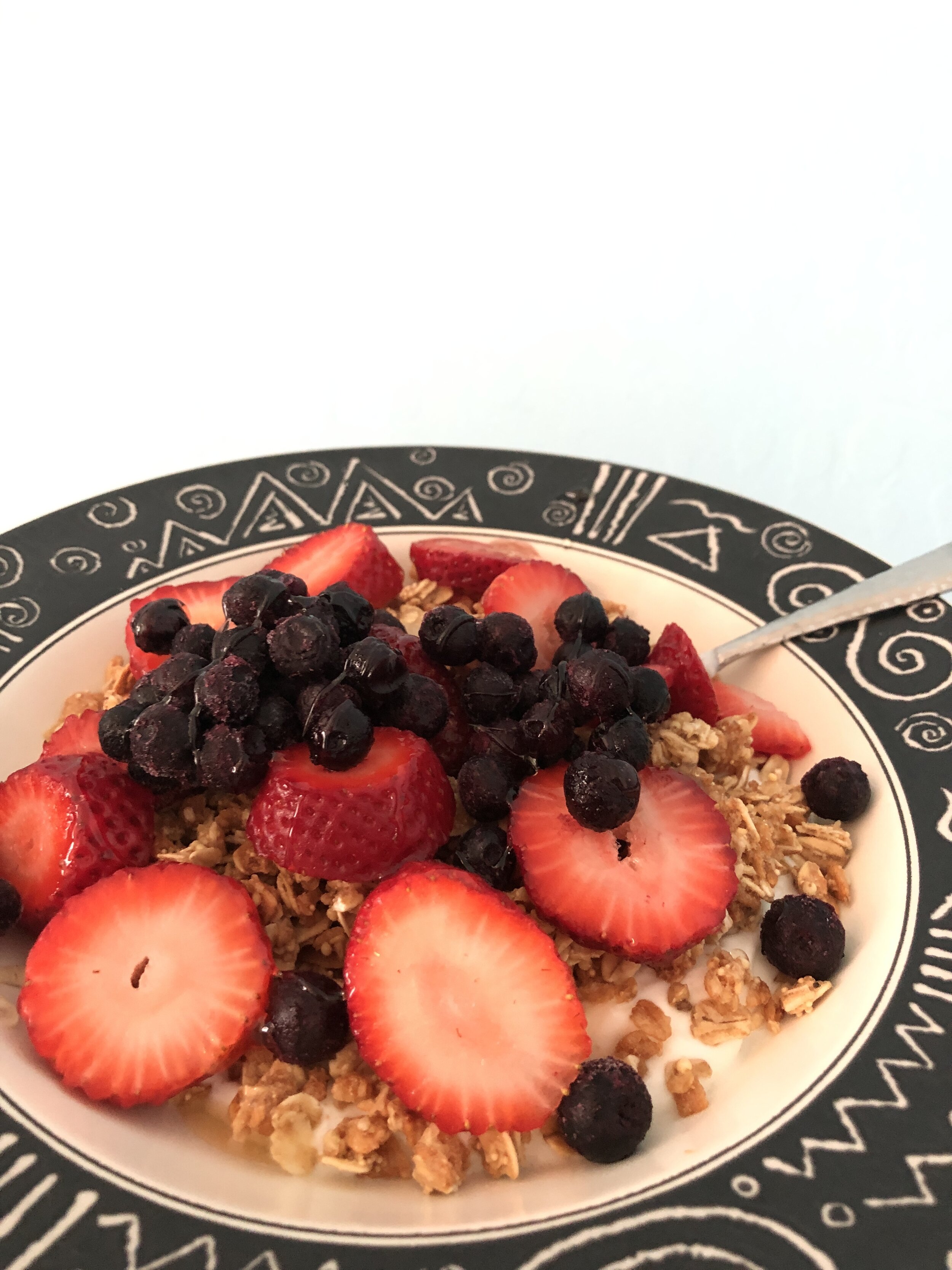 plain yogurt with gluten free granola, fruit, and honey