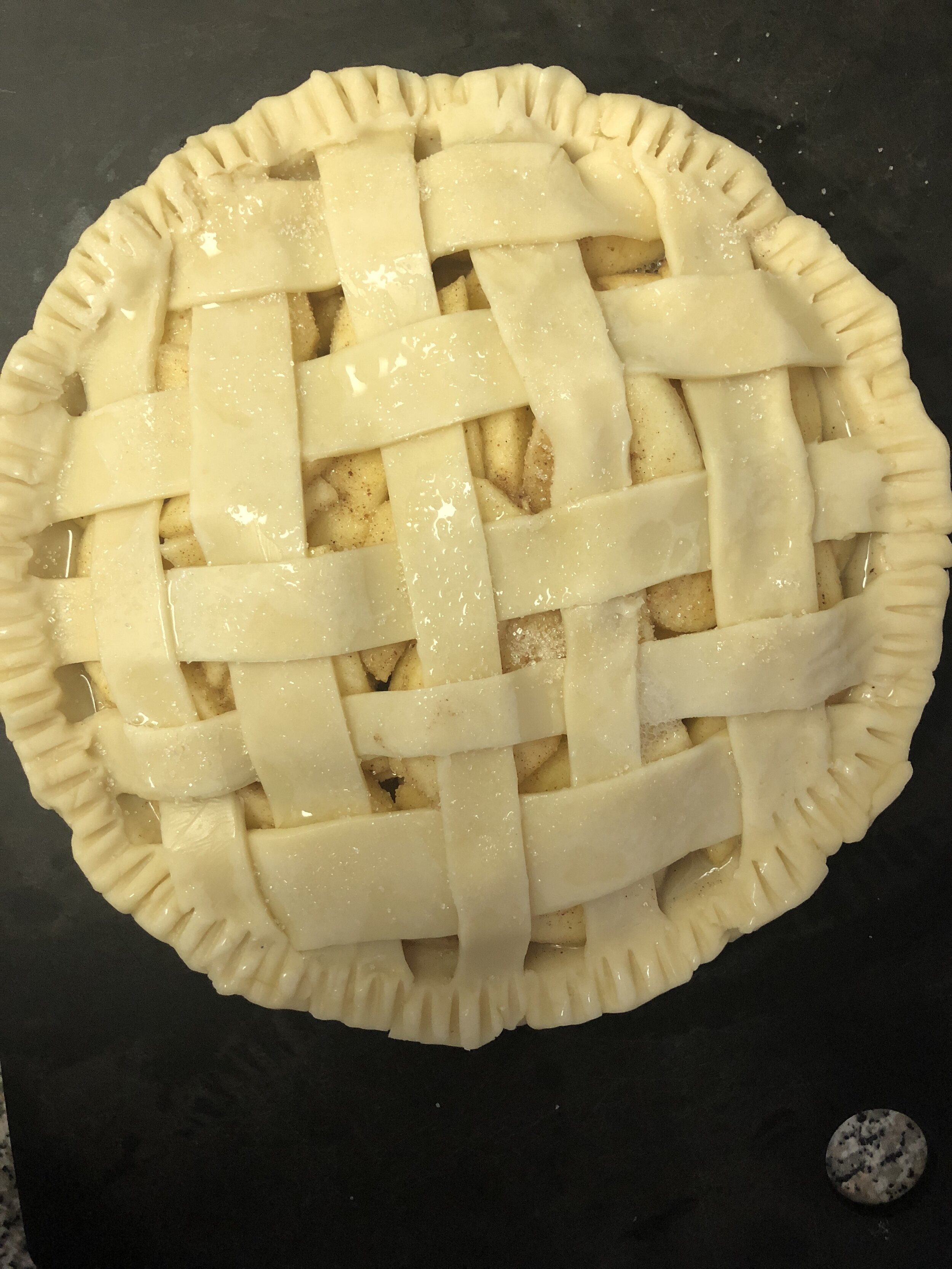 gluten free apple pie with latticework top before the oven.