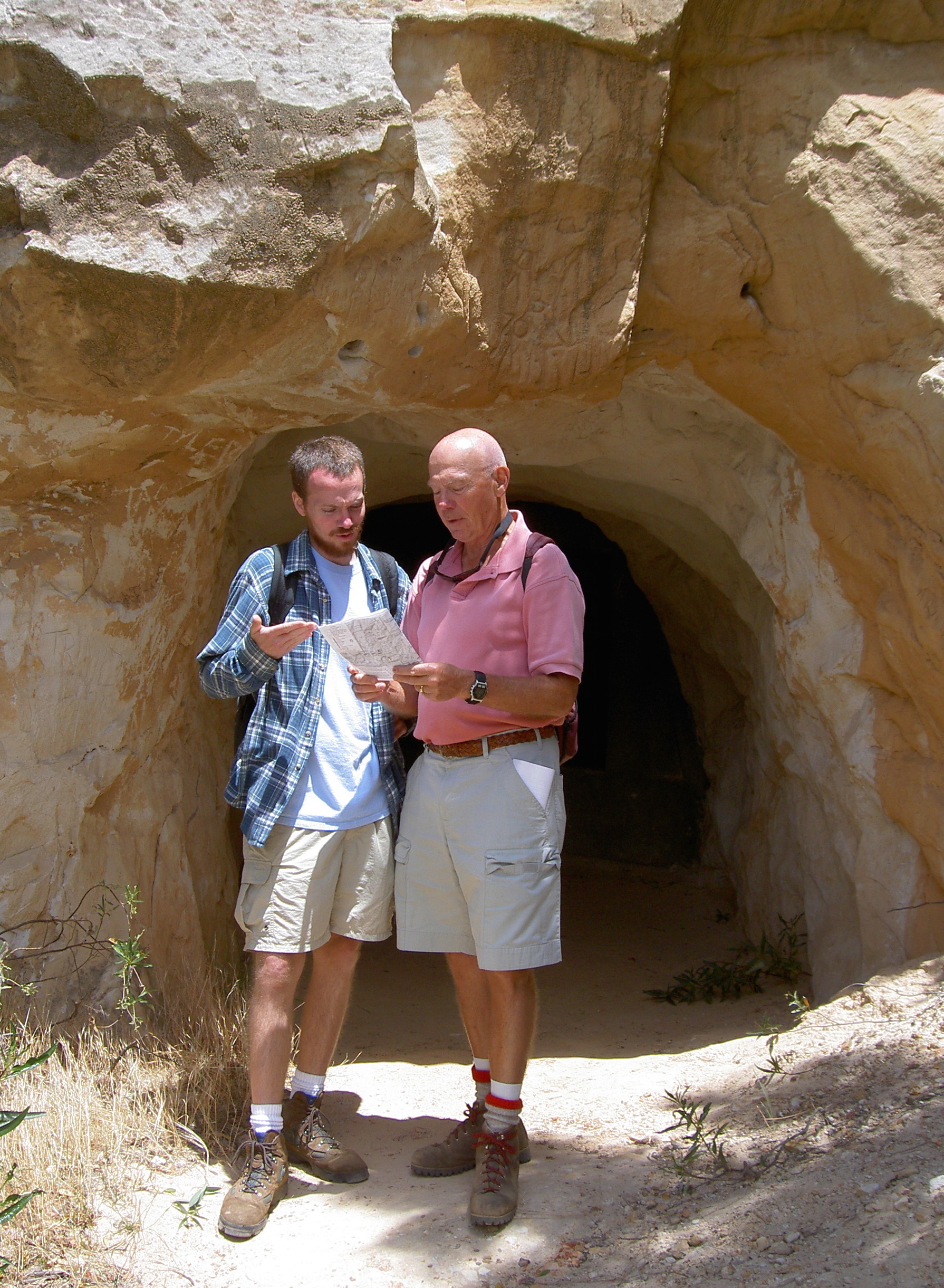 Hikers plot their next move by the mouth of a stope opening near the Hazel-Atlas Mine.