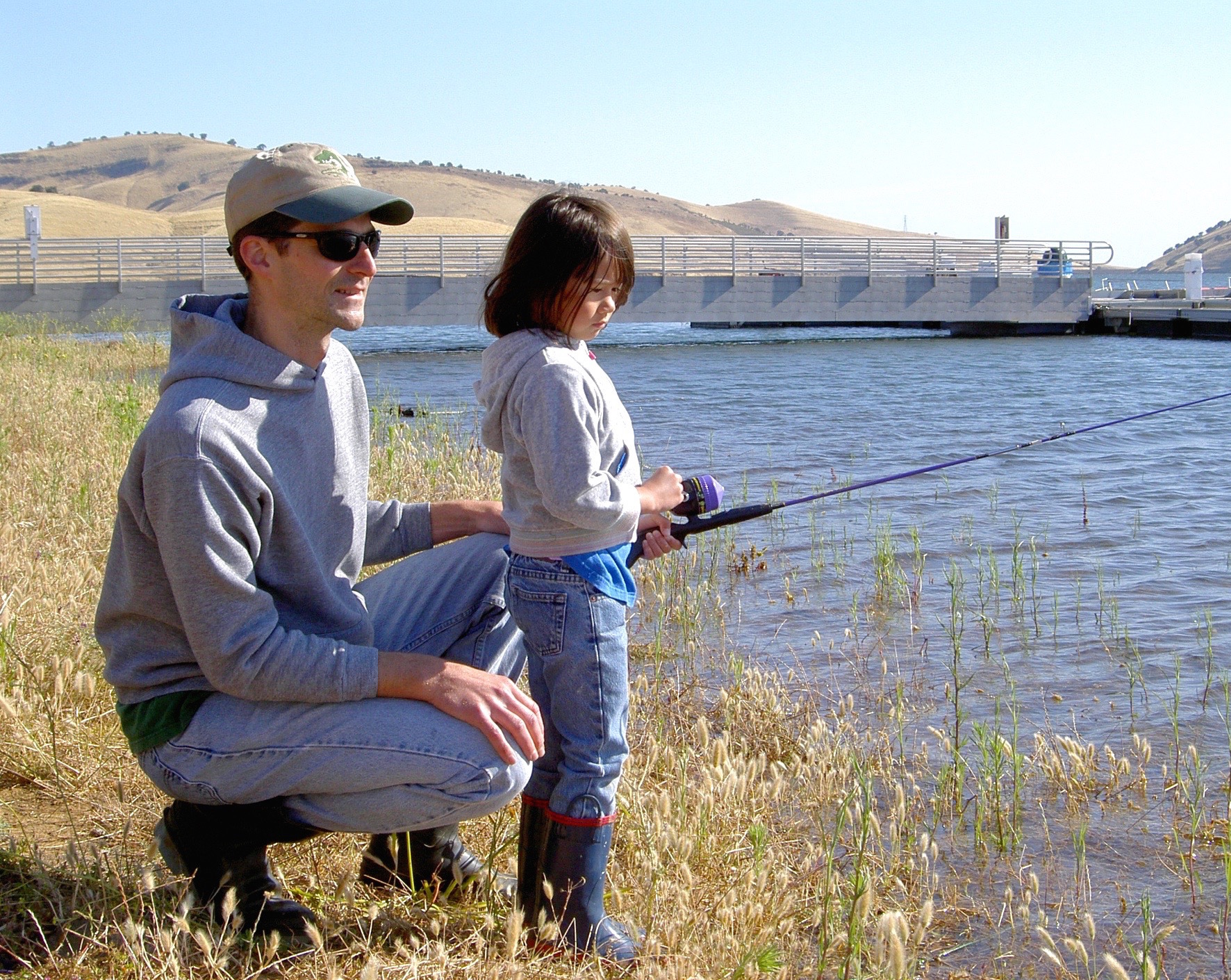 Father and daughter get hooked on one of Los Vaqueros' many family-oriented events.