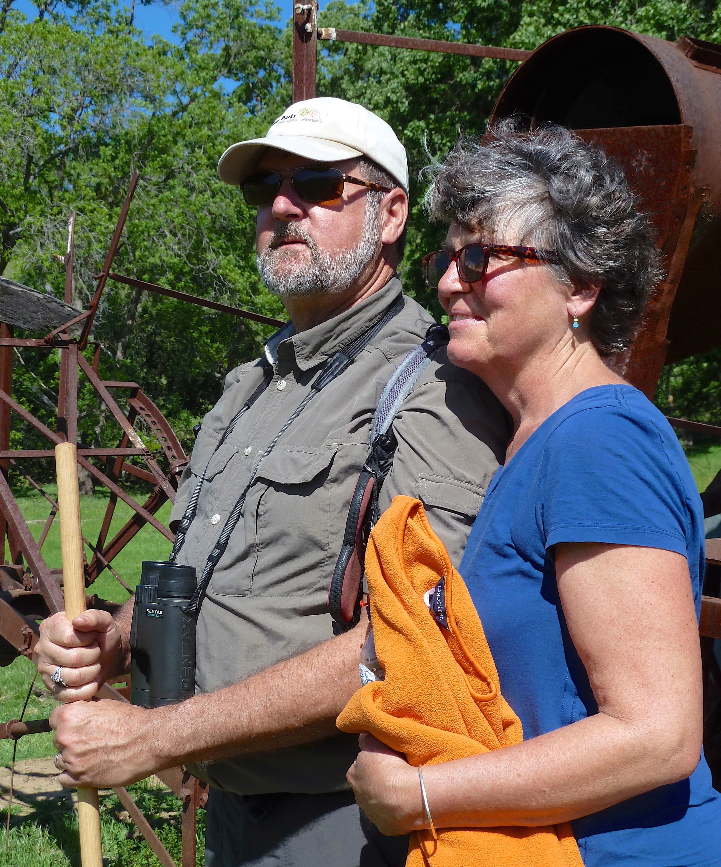 Bob Doyle and Tina Batt soak in the spring sunlight in Murphy Meadow, Round Valley Regional Preserve.