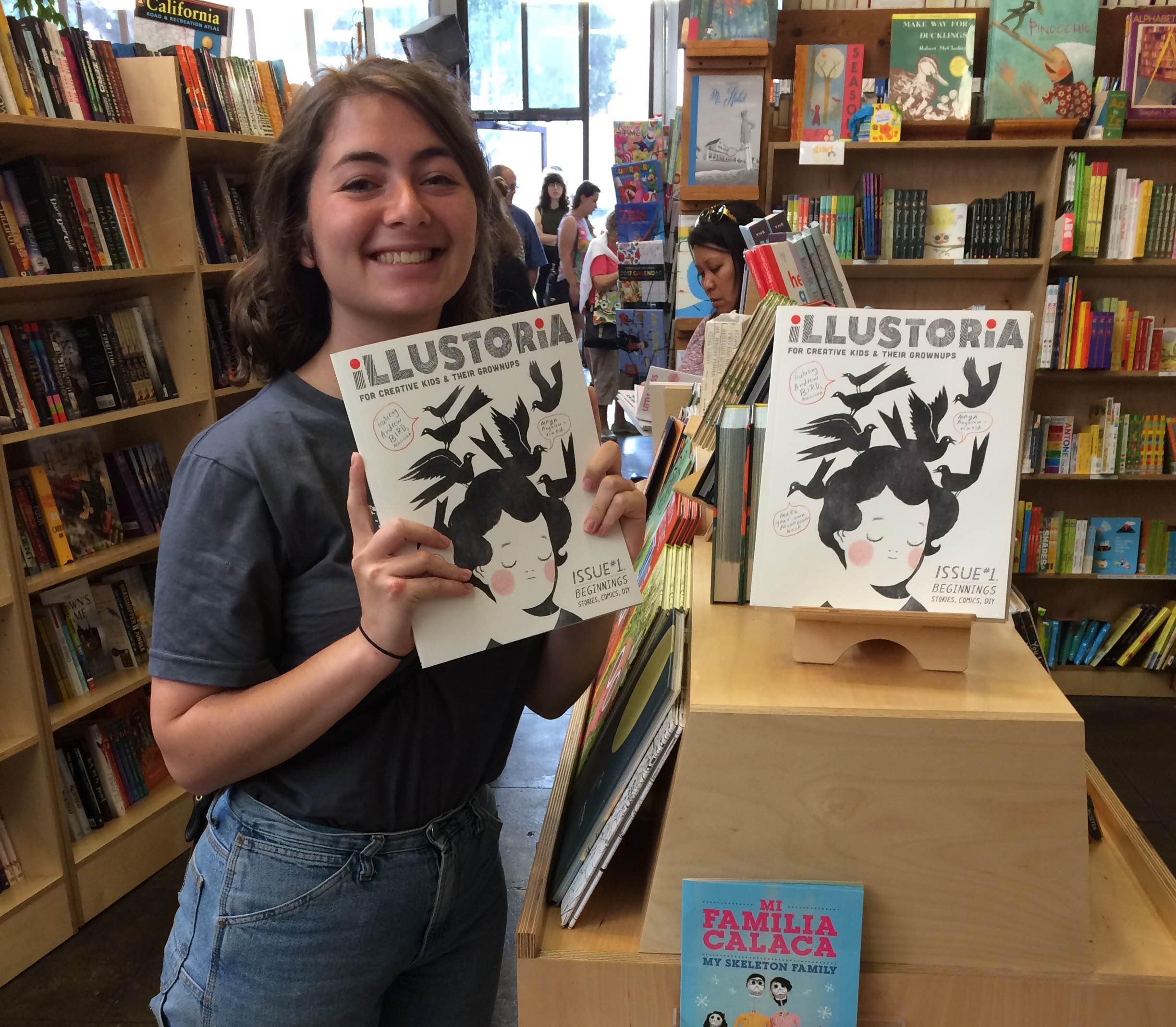 Claire holding the first issue of Illustoria at Skylight Books in Los Angeles.