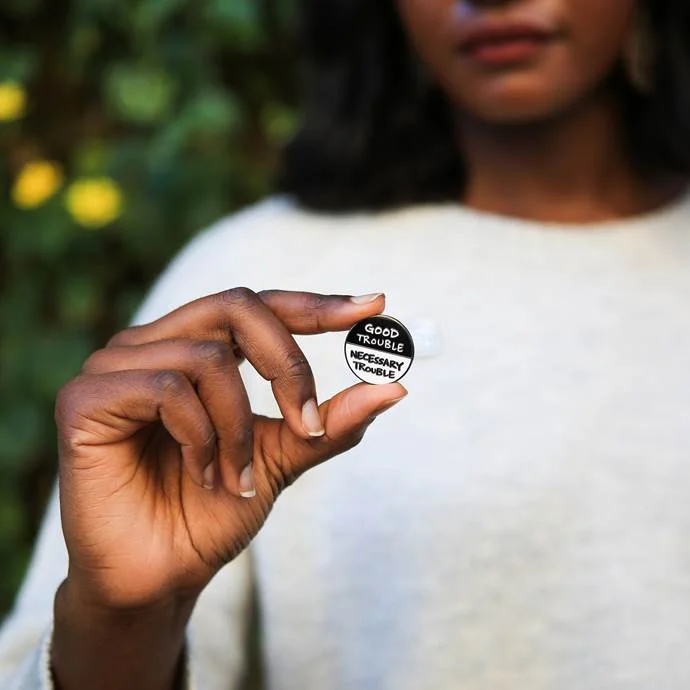 MARCH pin, photograph taken by Chronicle Books