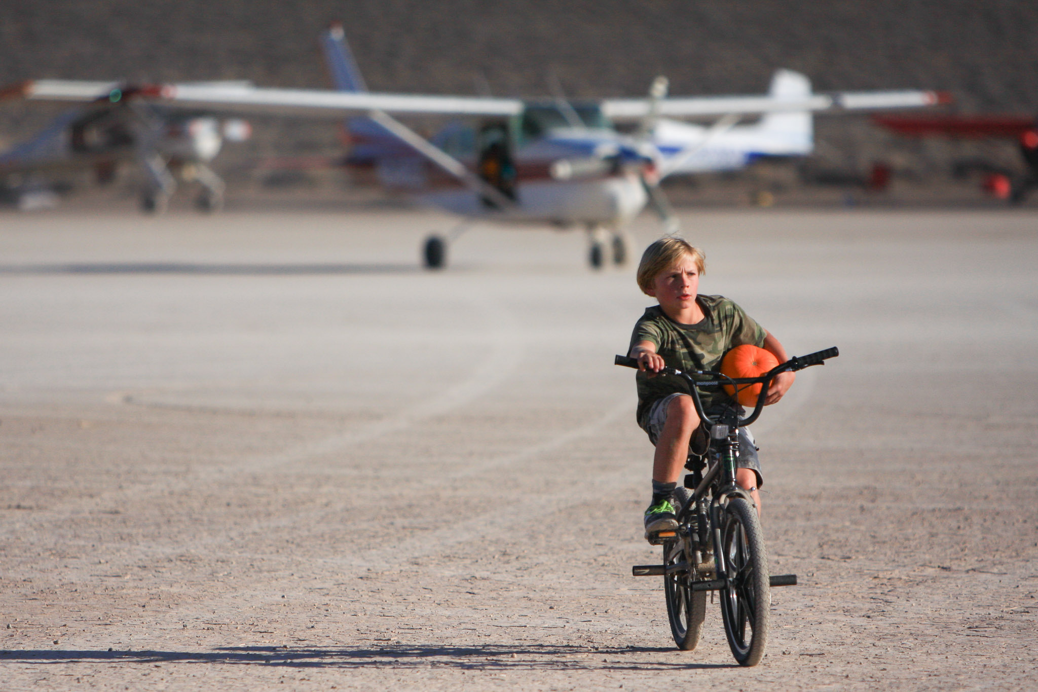 Everyone knows what it's like to be the kid on a bike at a desert fly-in, hauling ammo for the pumpkin drop.