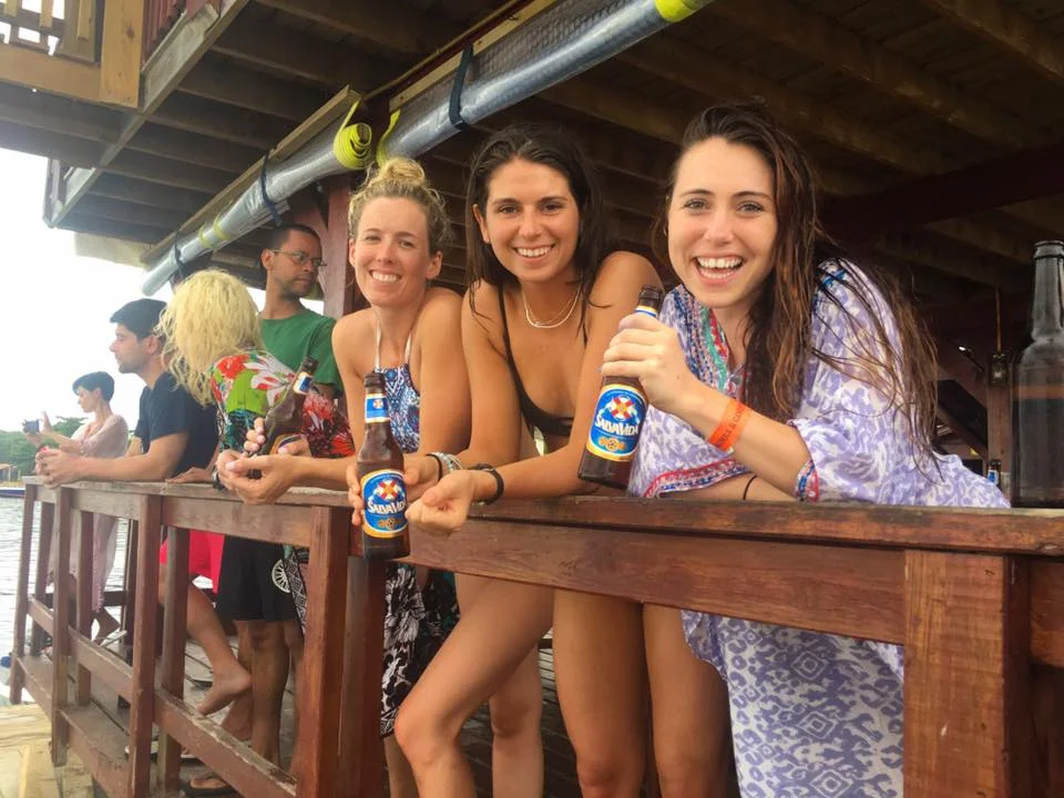 Callie, Atwood and Ally enjoying a beer while watching people get 'blobbed' into the water...