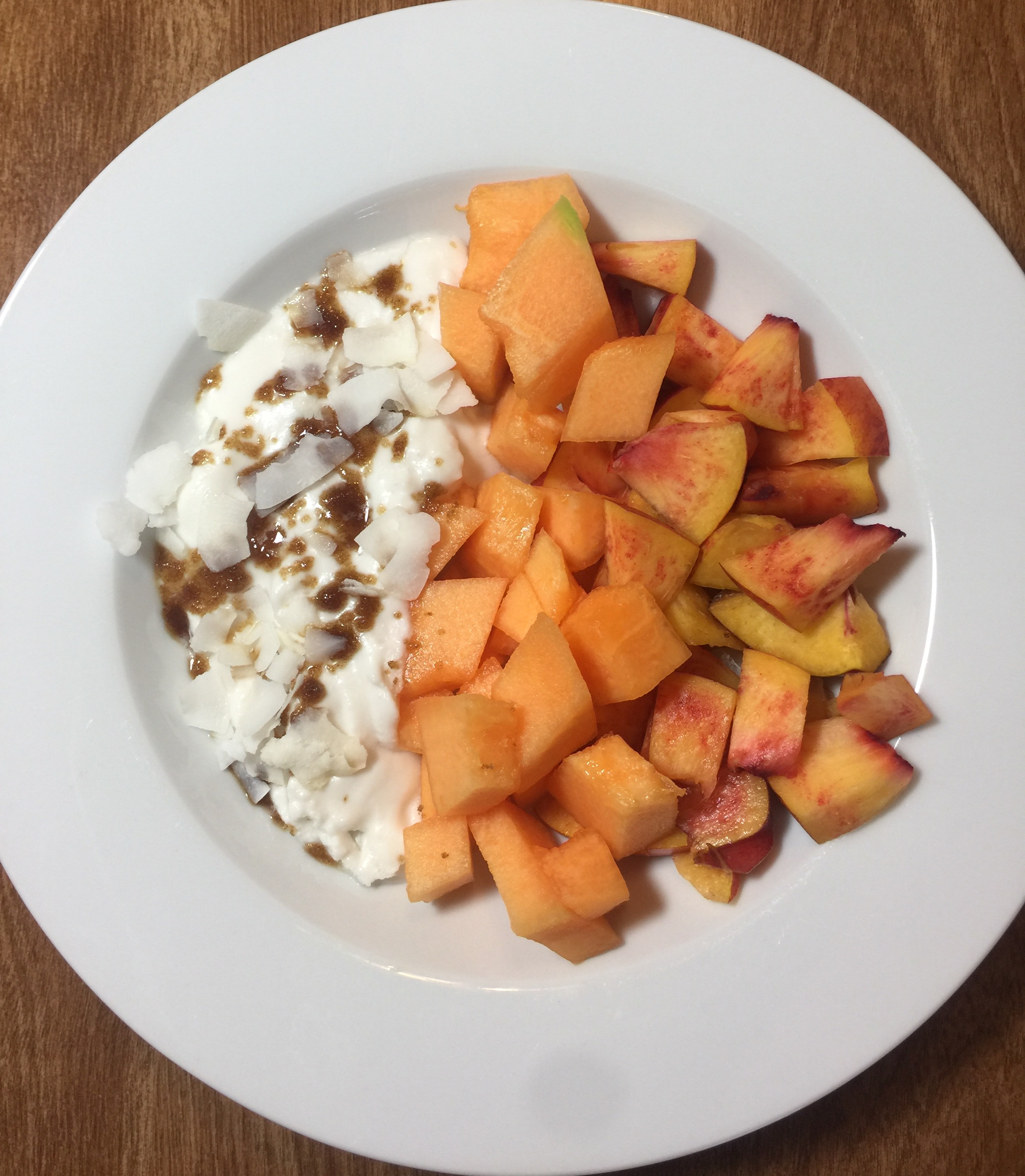Cultured Coconut Yogurt with fruit, brown sugar and coconut flakes.