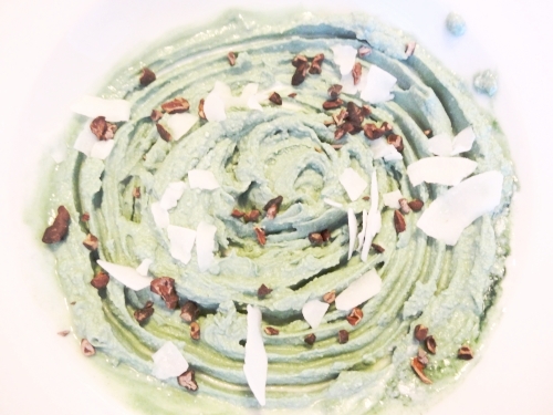 Cultured Coconut Yogurt with spirulina, coconut flakes and cacao nibs