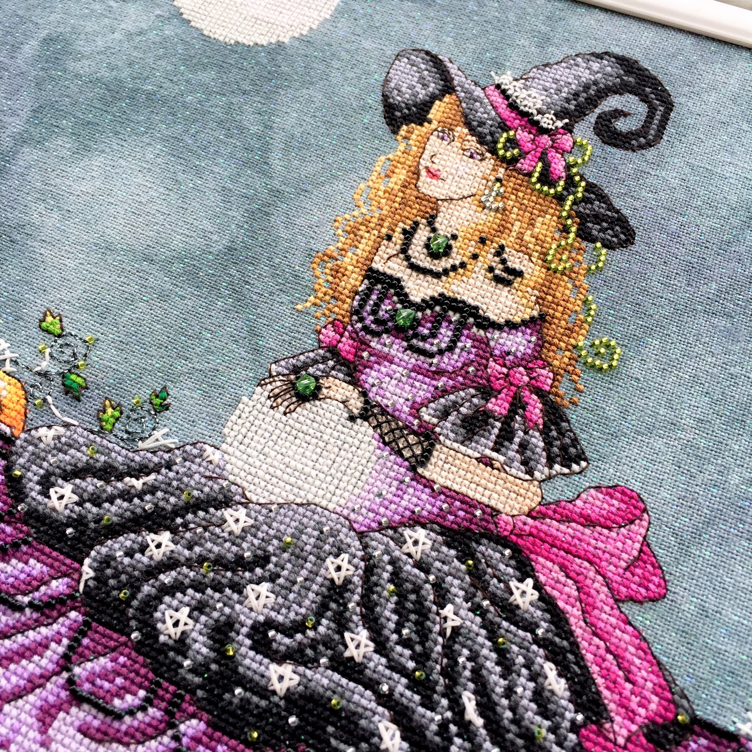 Luna, stitched on 32 count Crystal Haunted by Picture this Plus fabrics using DMC, Kreinik and Mill Hill beads. ©Shannon Wasilieff, 2017