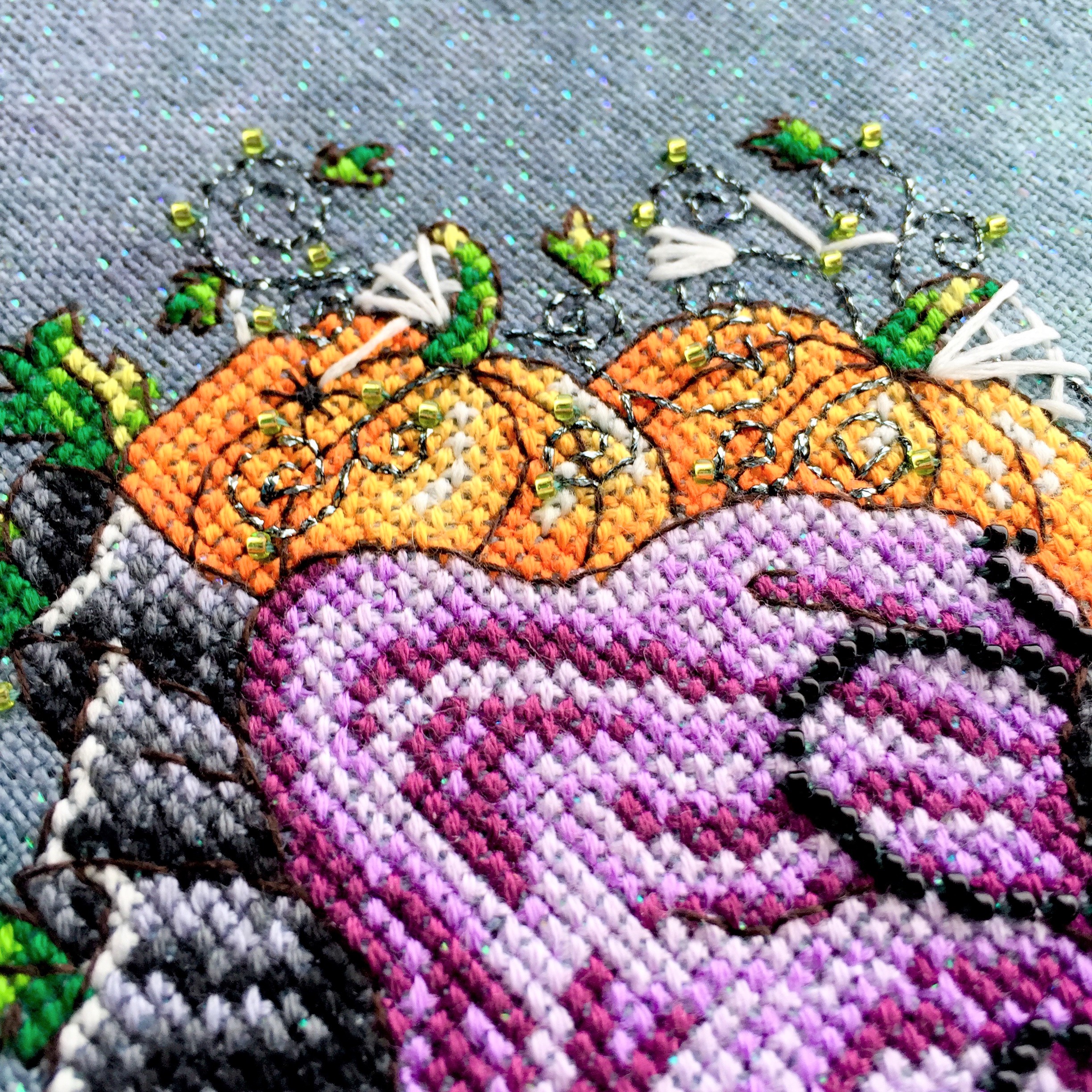 Close up of pumpkins on Luna, stitched on 32 count Crystal Haunted by Picture this Plus fabrics using DMC, Kreinik and Mill Hill beads. ©Shannon Wasilieff, 2017