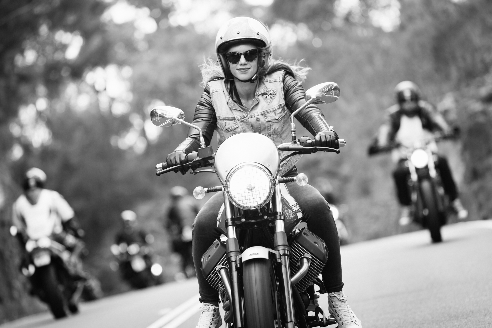 Nina from the Throttle Dolls on a Moto Guzzi V7 Scrambler