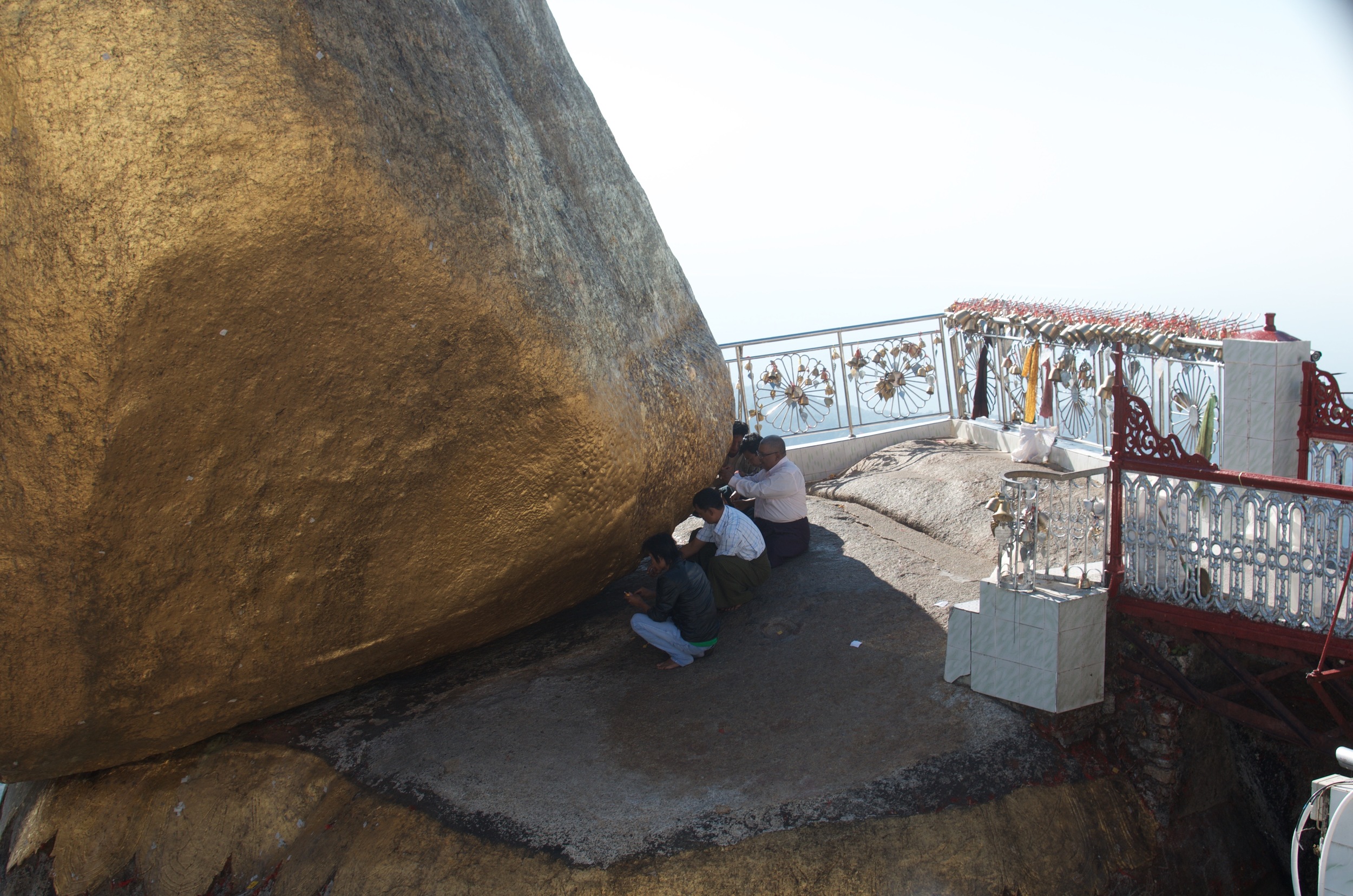 Men are allowed to cross the footbridge to the Rock to touch it and add gold leaves to preserve its sheen, but women are forbidden. 