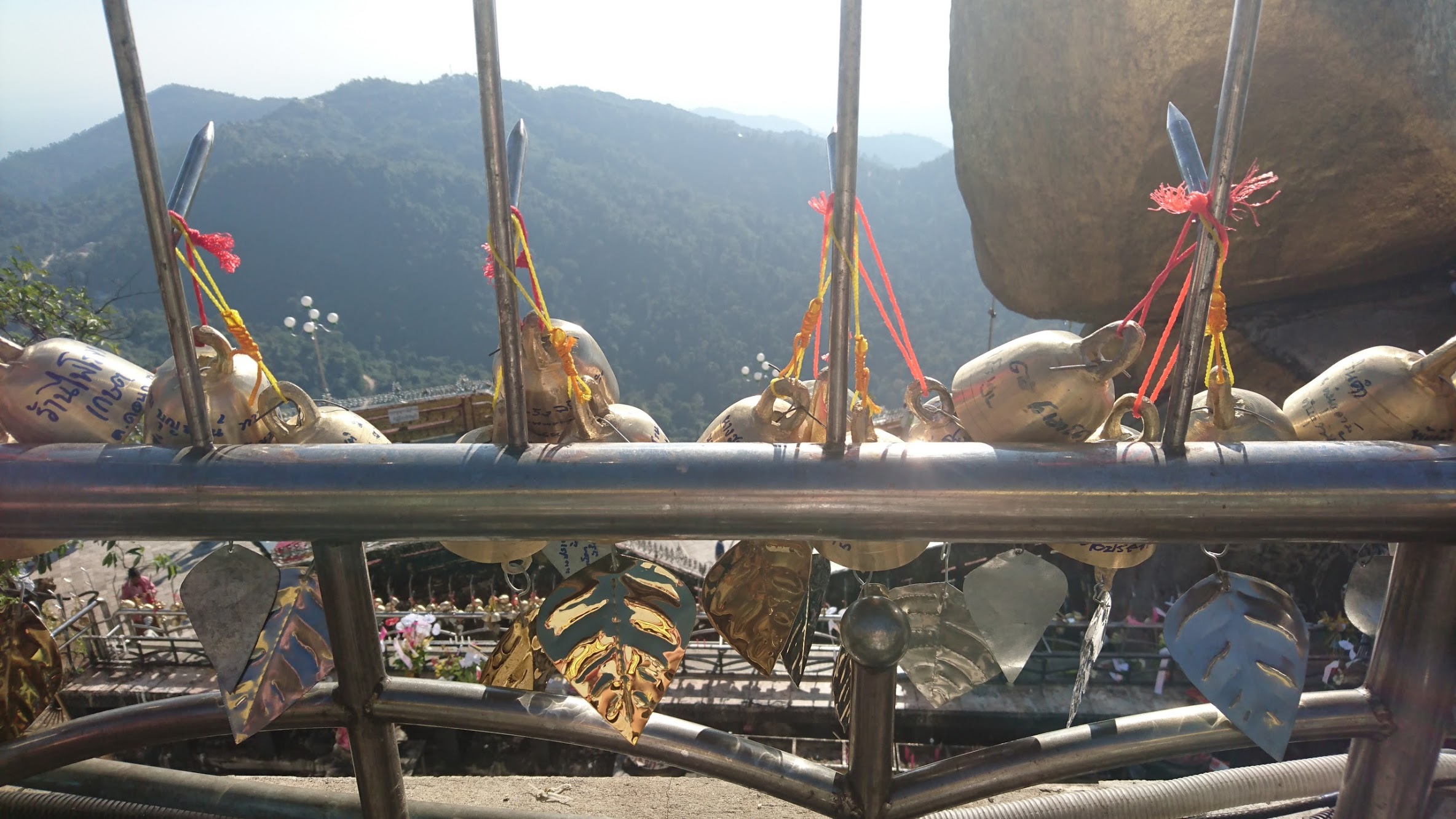 You can purchase golden bells or leaves and hang them over the side of the railings.