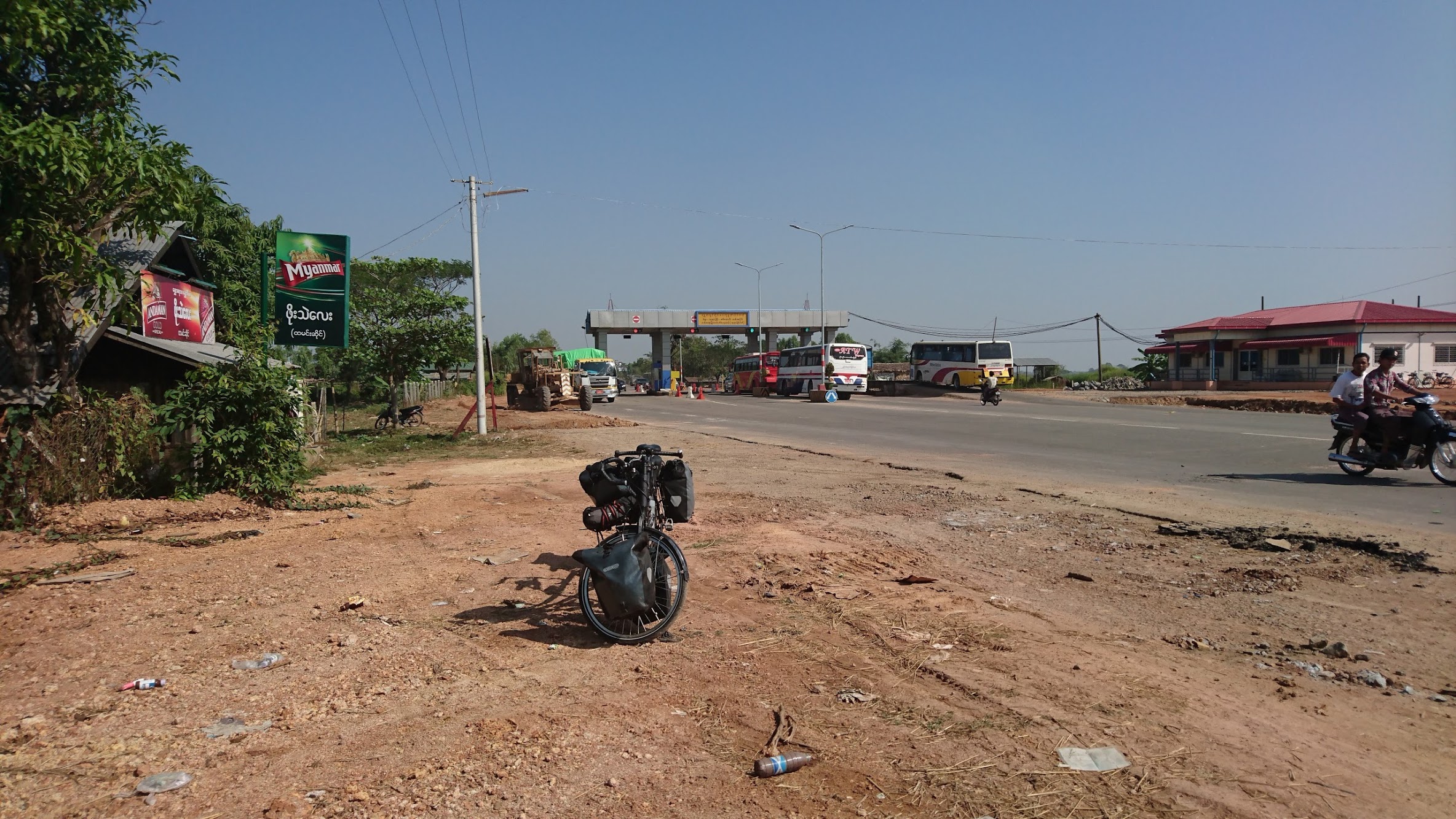 Going through a toll and seeing the German/Polish couple we had spoken to in Myawaddy cycling past us in the opposite direction, which confused us since we had started off on the same route.